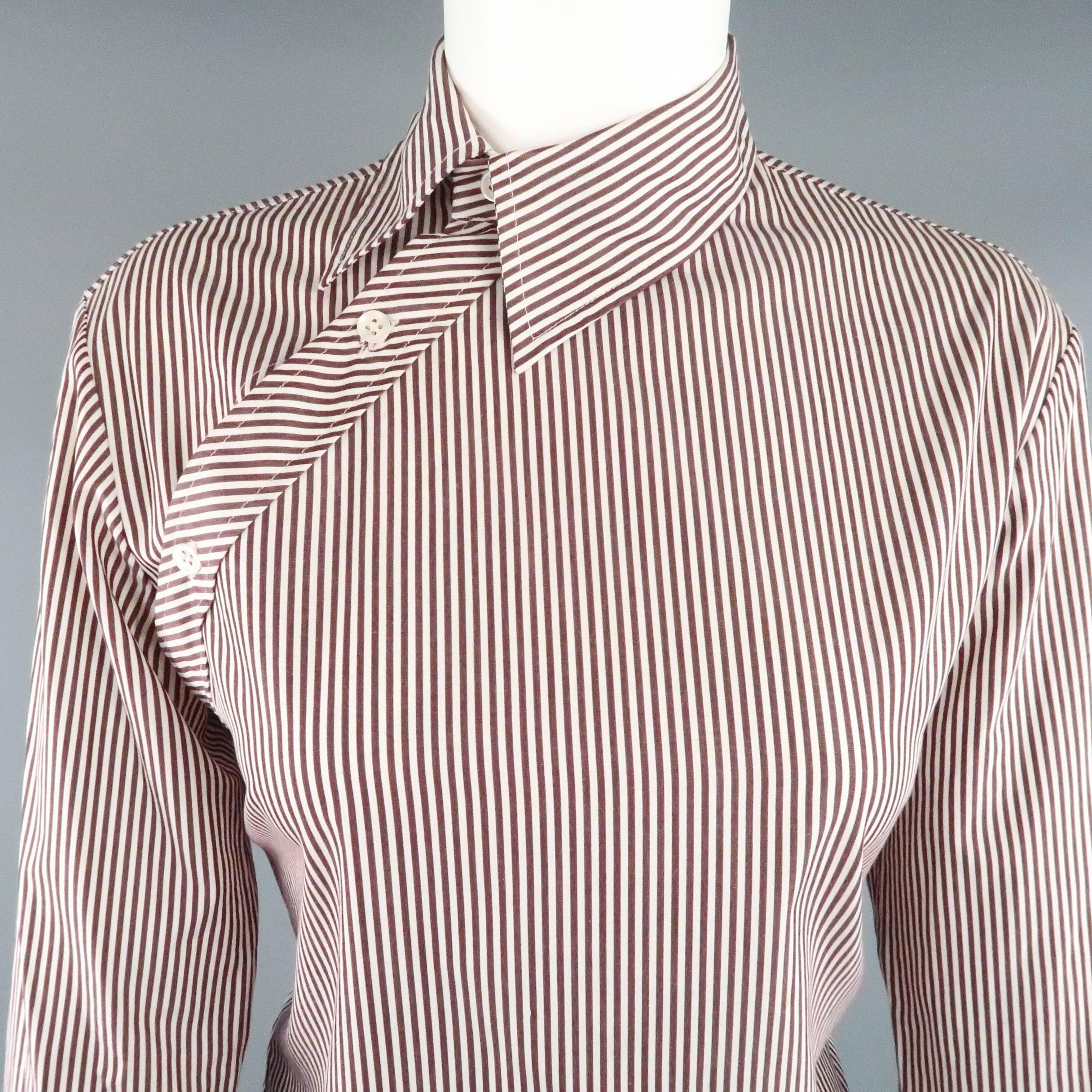 Avant garde dress top from rare early 1990's label COPPERWHEAT BLUNDELL comes in burgundy and white striped cotton and features a pointed collar, asymmetrical button closure, and French cuffs. Small discolorations shown in detail shots. As-Is.  Made