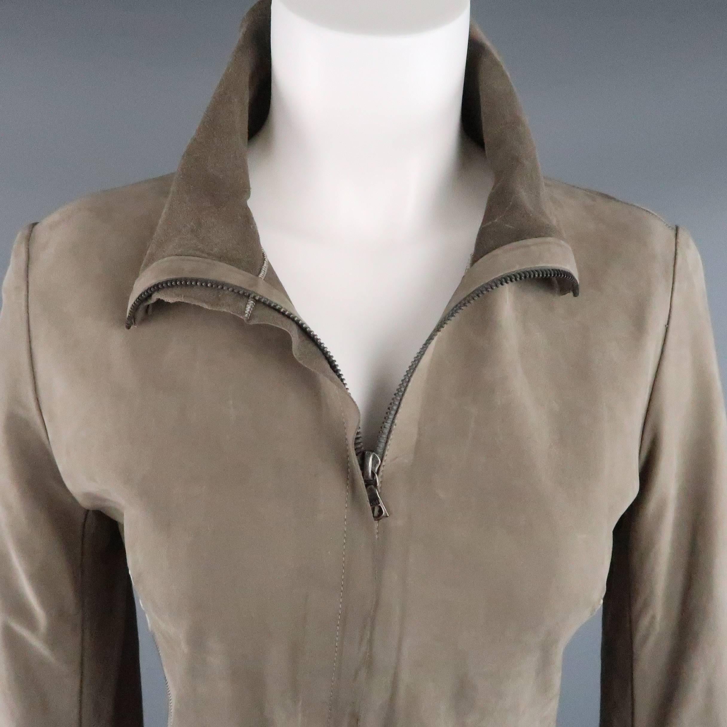 EXPERIENCE by ISAAC SELLAM jacket comes in a light weight, distressed taupe nubuck leather and features silver stitching details, hidden placket double zip closure, high collar, and silver tone 