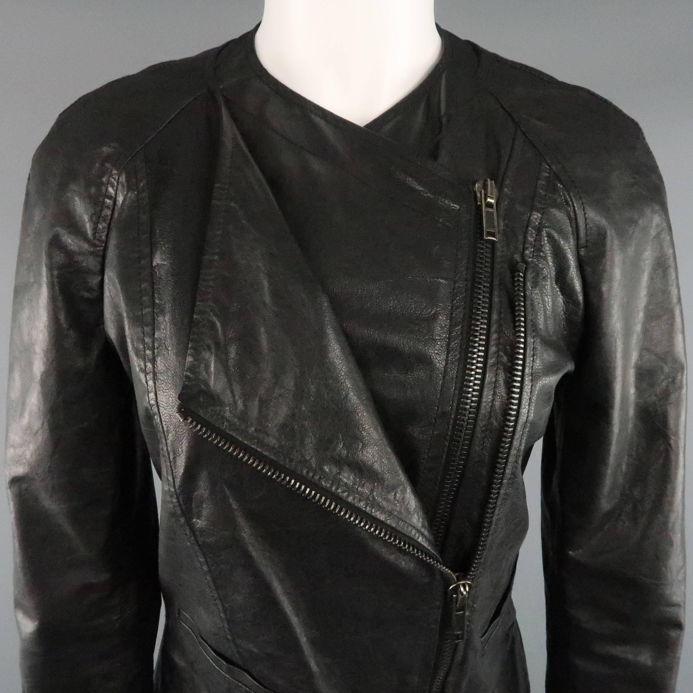 HAIDER ACKERMANN biker jacket comes in a shiny textured leather and features a collarless neckline, raglan sleeves, slit back, and asymmetrical layered, double zip closure. Made in Italy.
 
Good Pre-Owned Condition.
Marked: IT 38
 
Measurements:
