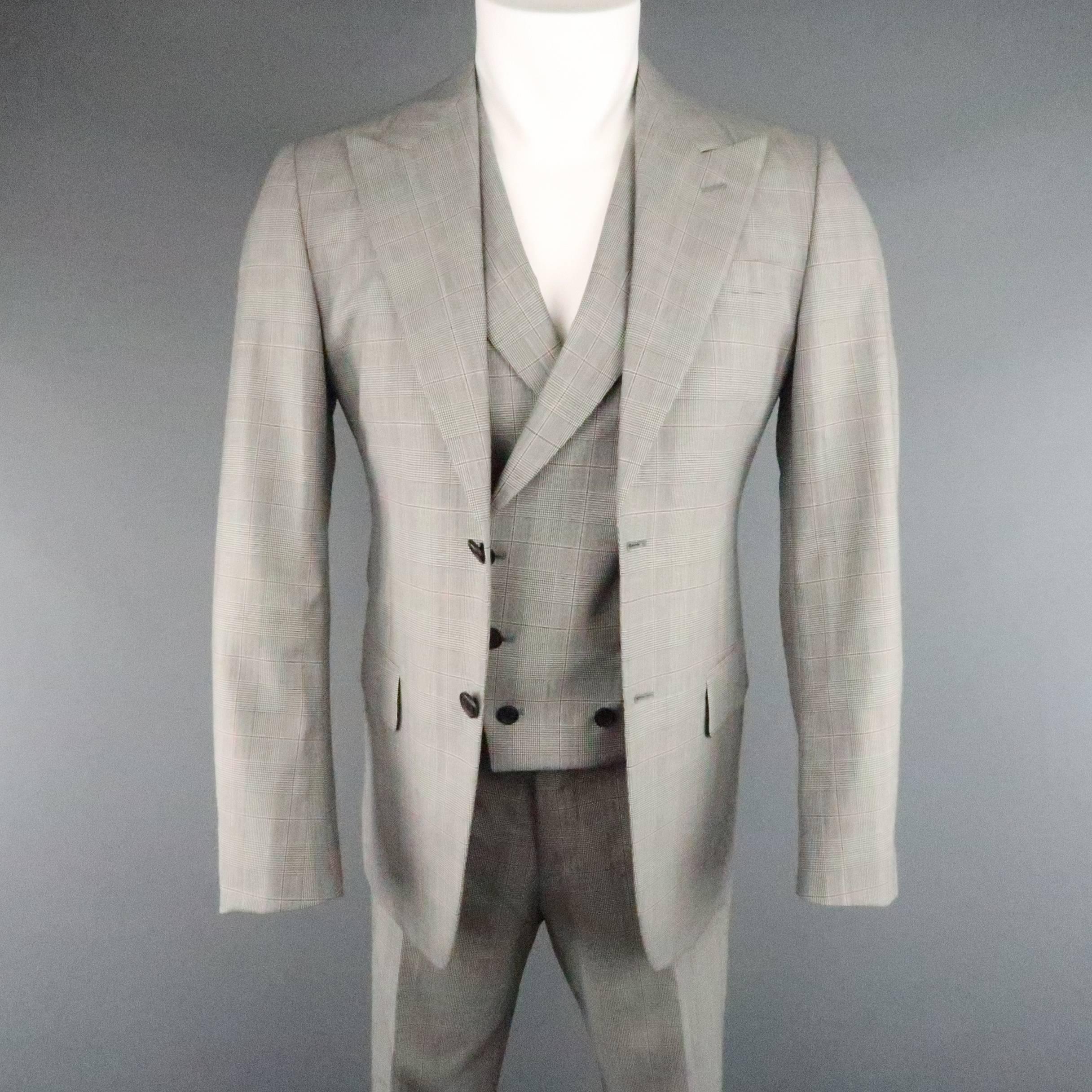 This modern classic three piece PRADA suit comes in a black and white glenplaid wool with deep red stripe and includes a two button, peak lapel sport coat, double breasted peak lapel vest with burgundy satin back, and flat front, cuffed trousers.