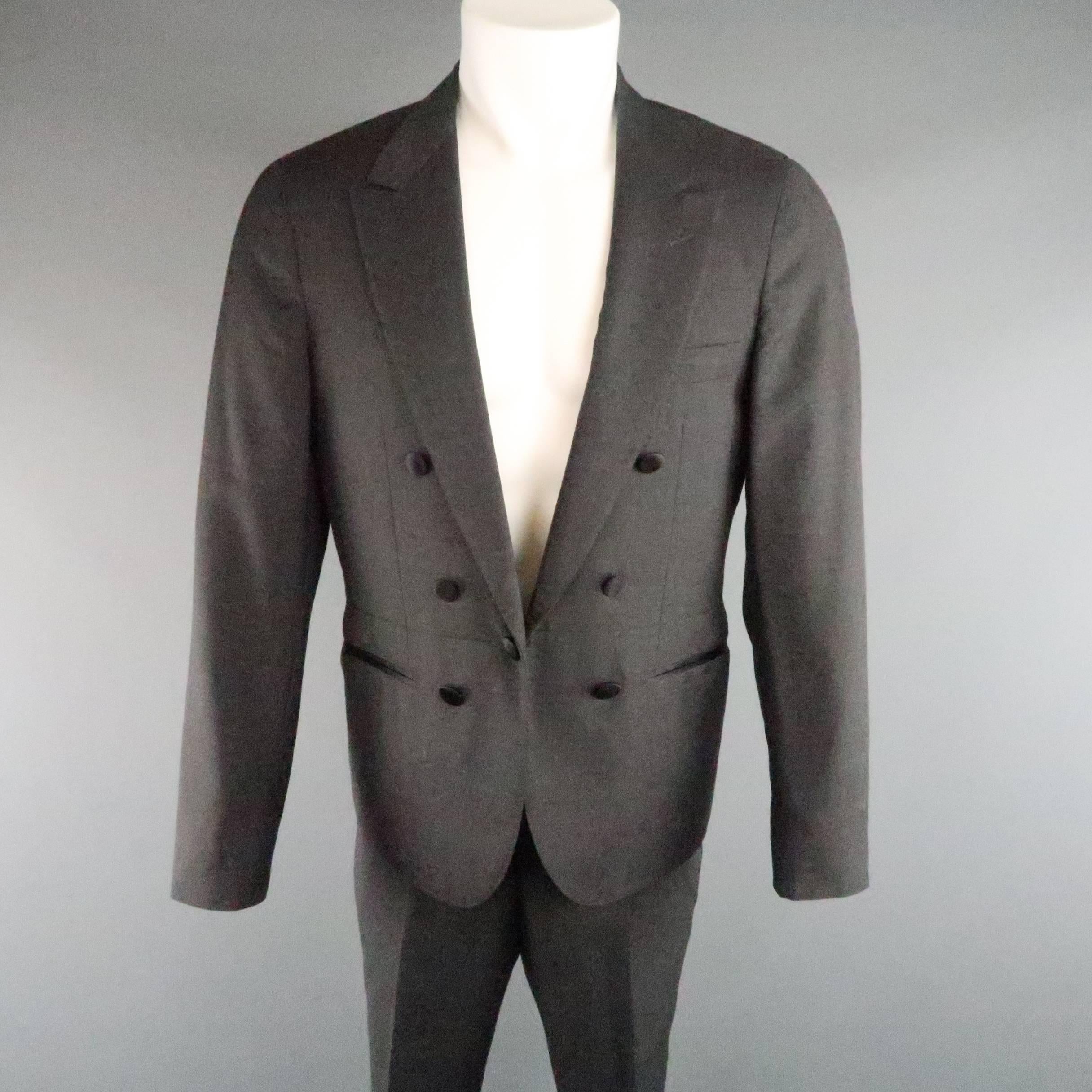 LANVIN tuxedo style suit comes in dark gray wool and includes a peak lapel dinner jacket with black satin buttons and matching flat front trousers. button closure has one side replaced with a regular button. As-Is. Made in Italy.
 
Good Pre-Owned
