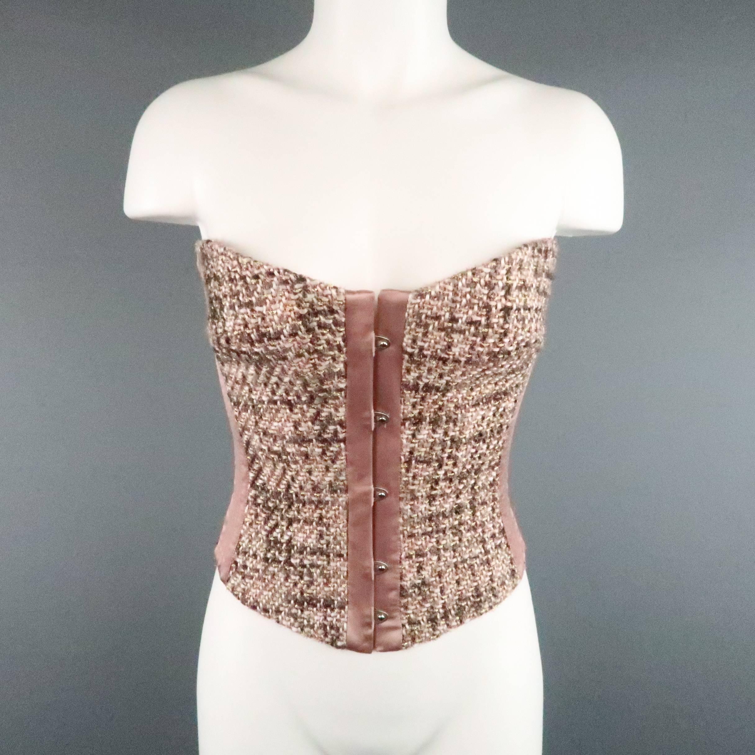 This fabulous ROBERTO CAVALLI steel boned corset comes in a rose pink tweed with hints of gray, white, and metallic gold, and features a sweetheart bustline, hook eye closure front, satin panels, and lace up back with gold tone eyelets. Adjustable.