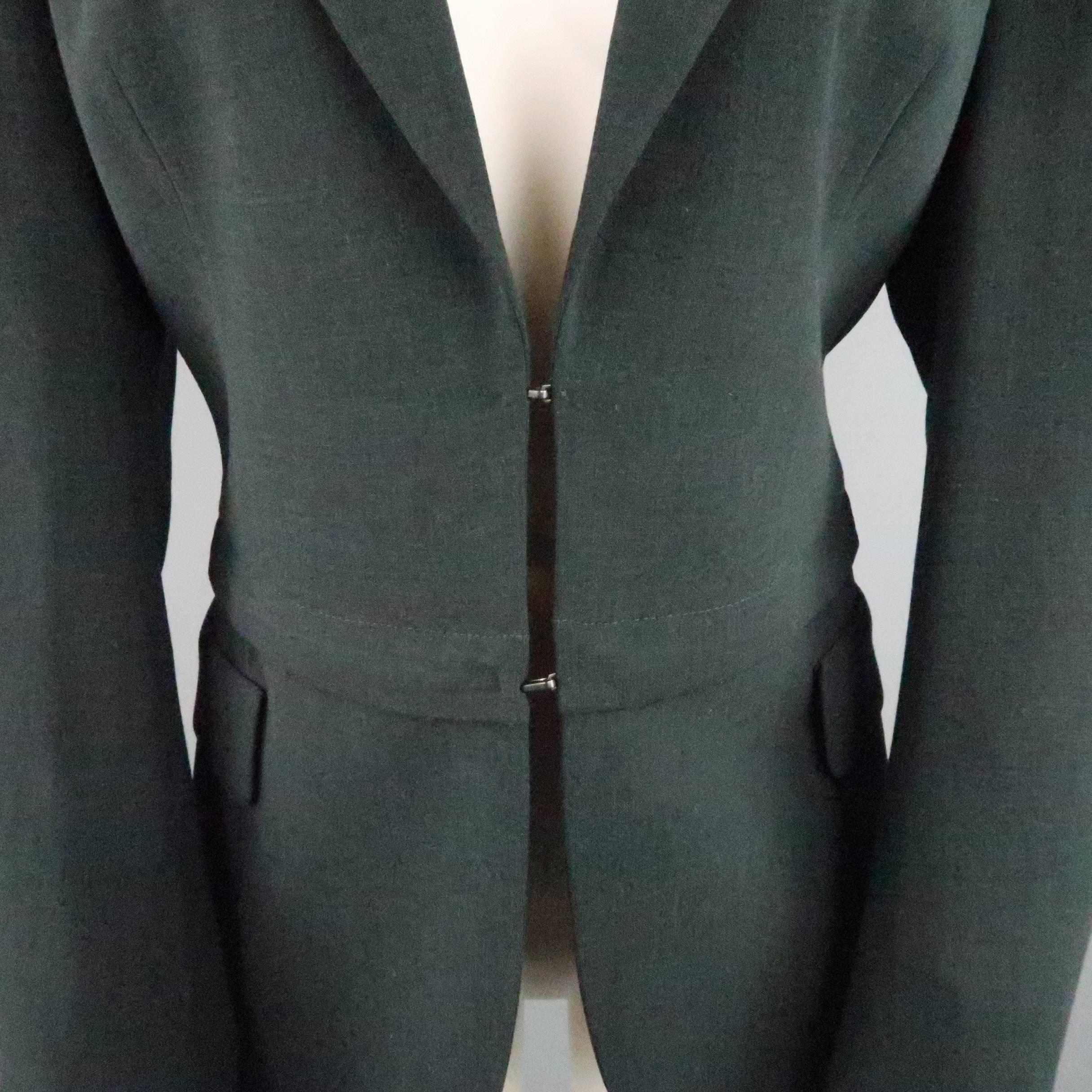 AKRIS blazer comes in forest green wool fabric and features a classic notch lapel, double hook eye closure, and detachable zip off panel with faux flap pockets. Made in Switzerland.
 
Excellent Pre-Owned Condition.
Marked: US 10
 
Measurements:
