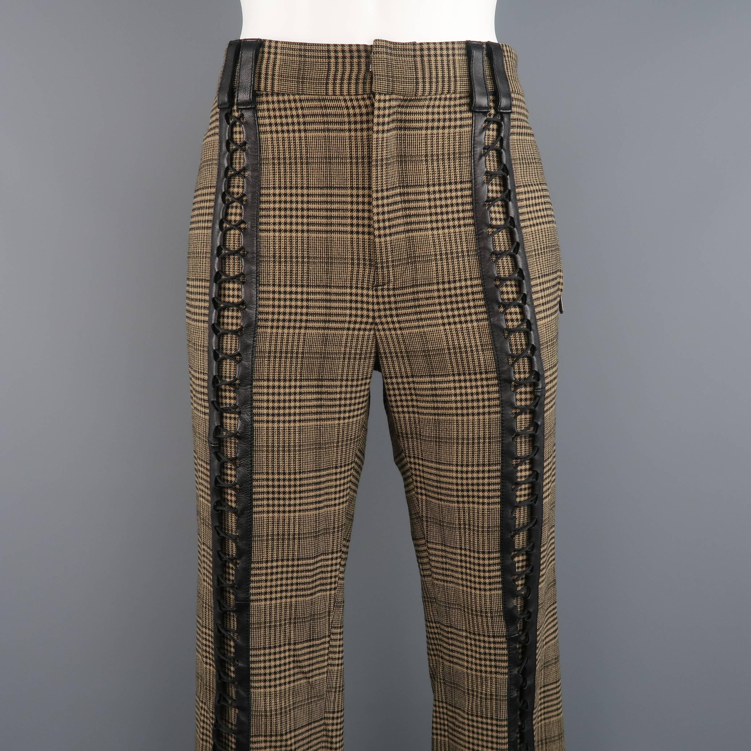 These rare vintage GAULTIER2 by JEAN PAUL GAULTIER dress pants come in a tan and black glenplaid print wool blend material and feature a tapered leg and black leather detailed lace up front. Made in Italy.
 
Excellent Pre-Owned Condition.
Marked: