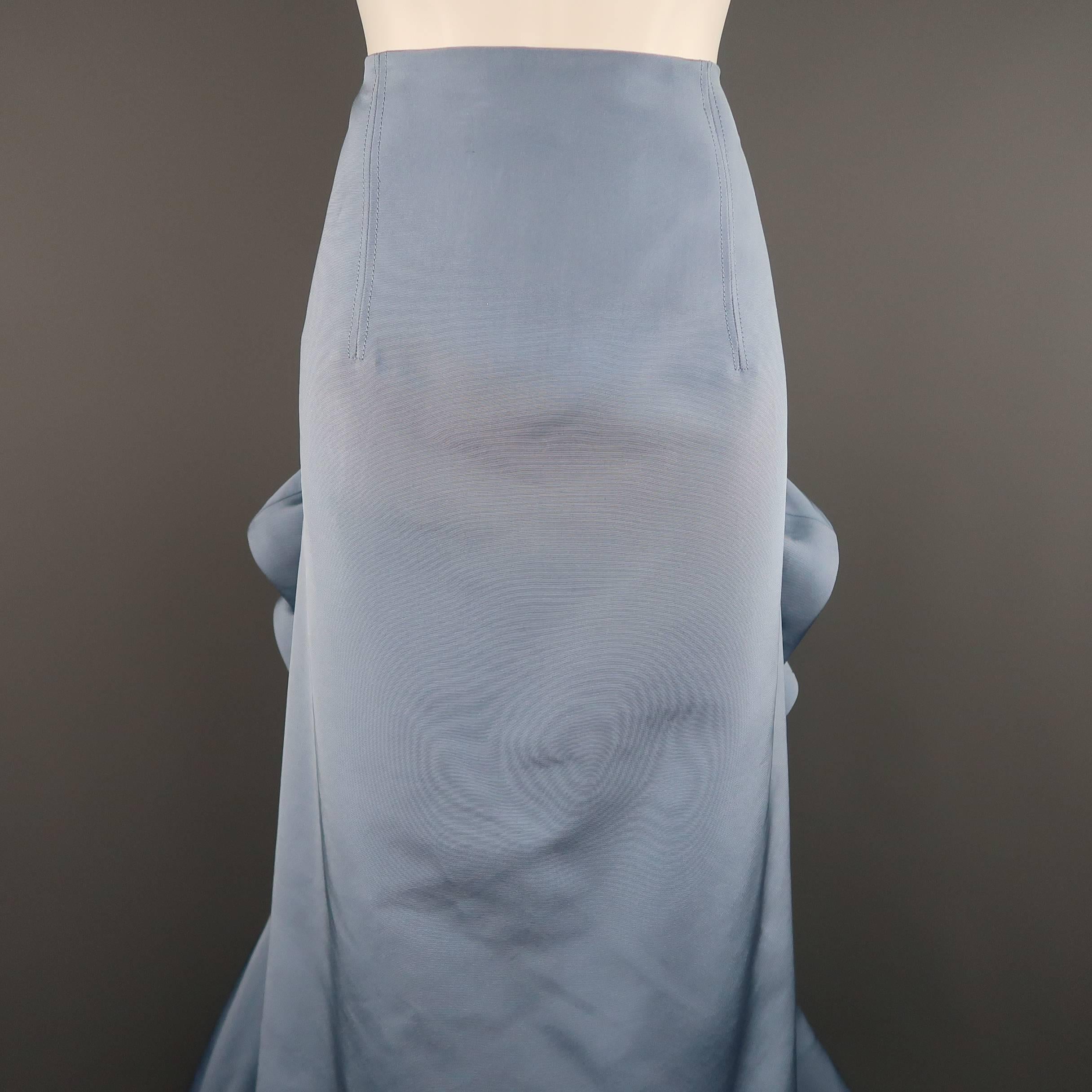 This stunning evening skirt by CAROLINA HERRERA comes in a light blue silk faille and features an A line pencil skirt style front, cascading side ruffles, and gathered ruffle back with peplum. Minor wear and discolorations shown in detail shots.