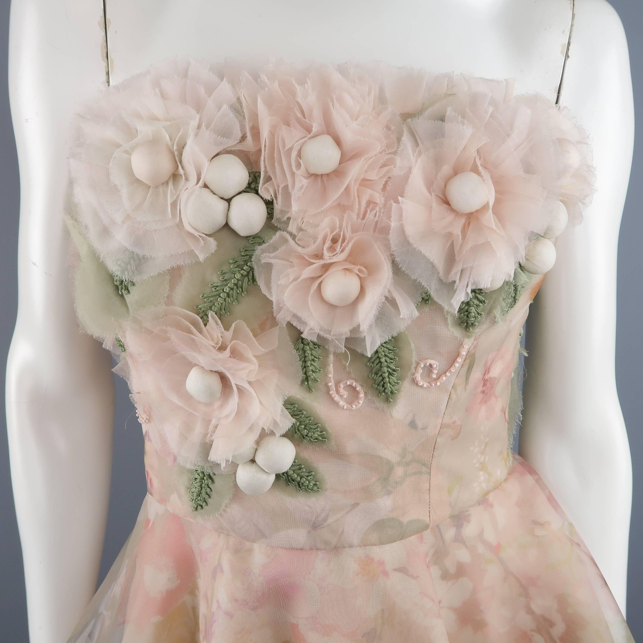 Dennis Basso strapless cocktail dress comes in light powder beige pink floral print sheer silk and features an embellished bustier bodice and ruffled A line fir flair skirt. Unzipped on mannequin. Full back in detail shot. Worn once. Hand Made USA.