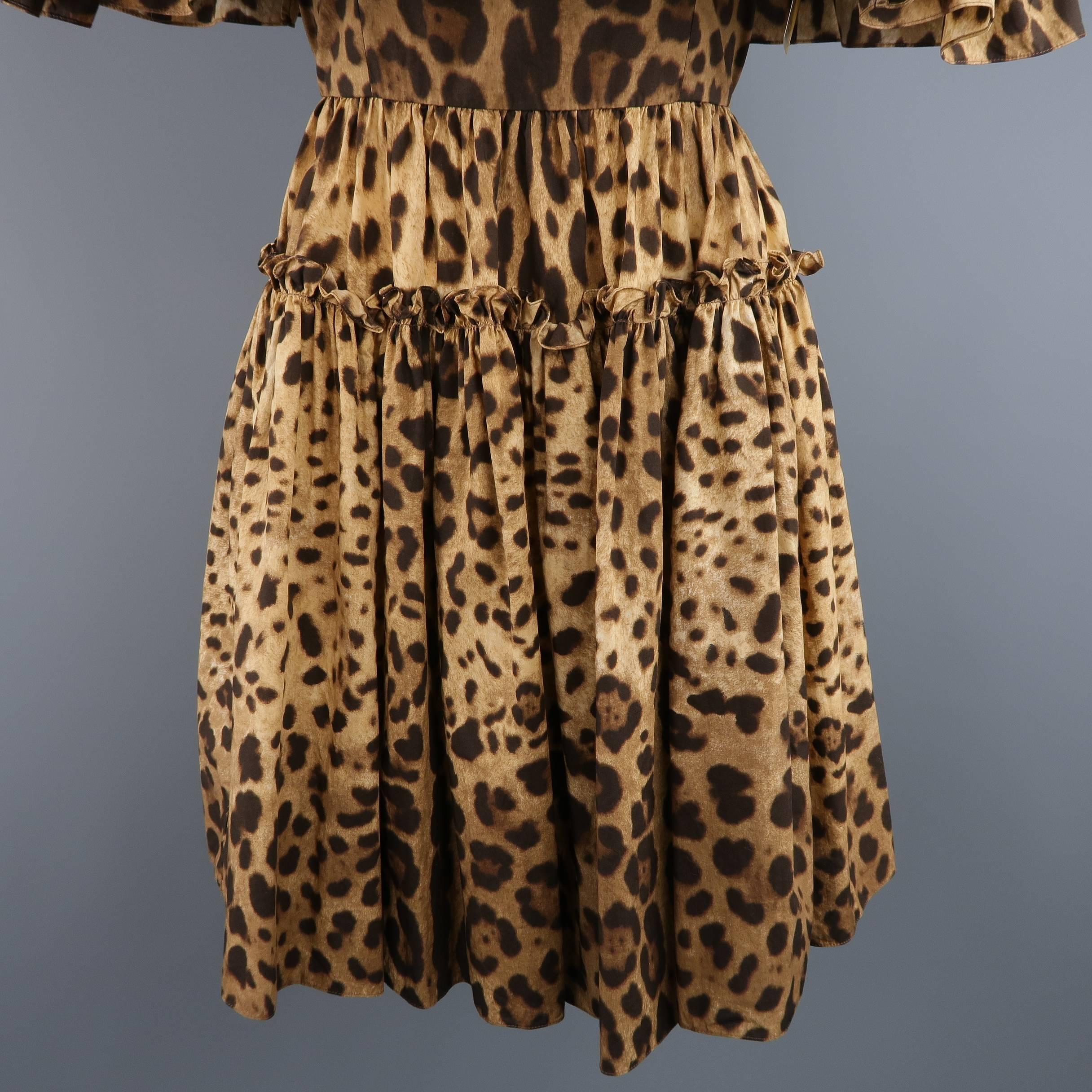 This fun DOLCE & GABBANA dress comes in a light weight leopard cheetah print cotton and features a ruffled off the shoulder neckline with straps, fitted mid section and ruffled flair skirt. Made in Italy.
 
Excellent Pre-Owned Condition.
Marked: IT