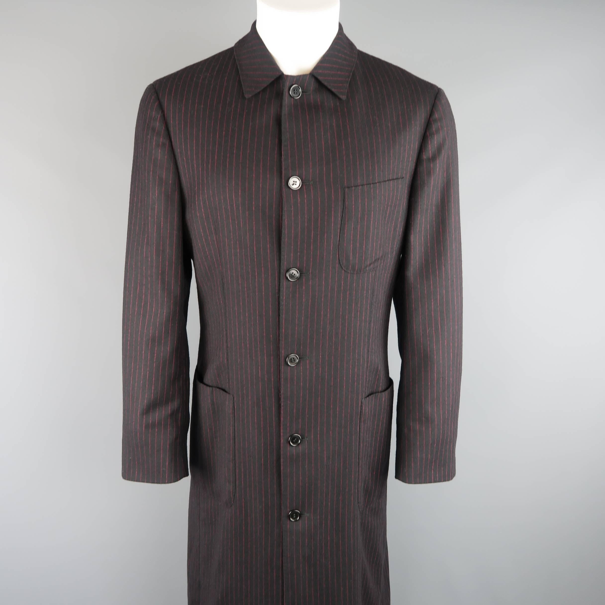 Archive ROMEO GIGLI coat comes in black and red pinstripe wool and features a classic pointed collar, six button front, patch pockets, button cuffs, and an extended, full length hemline.
 
Excellent Pre-Owned Condition.
Marked: IT 48
