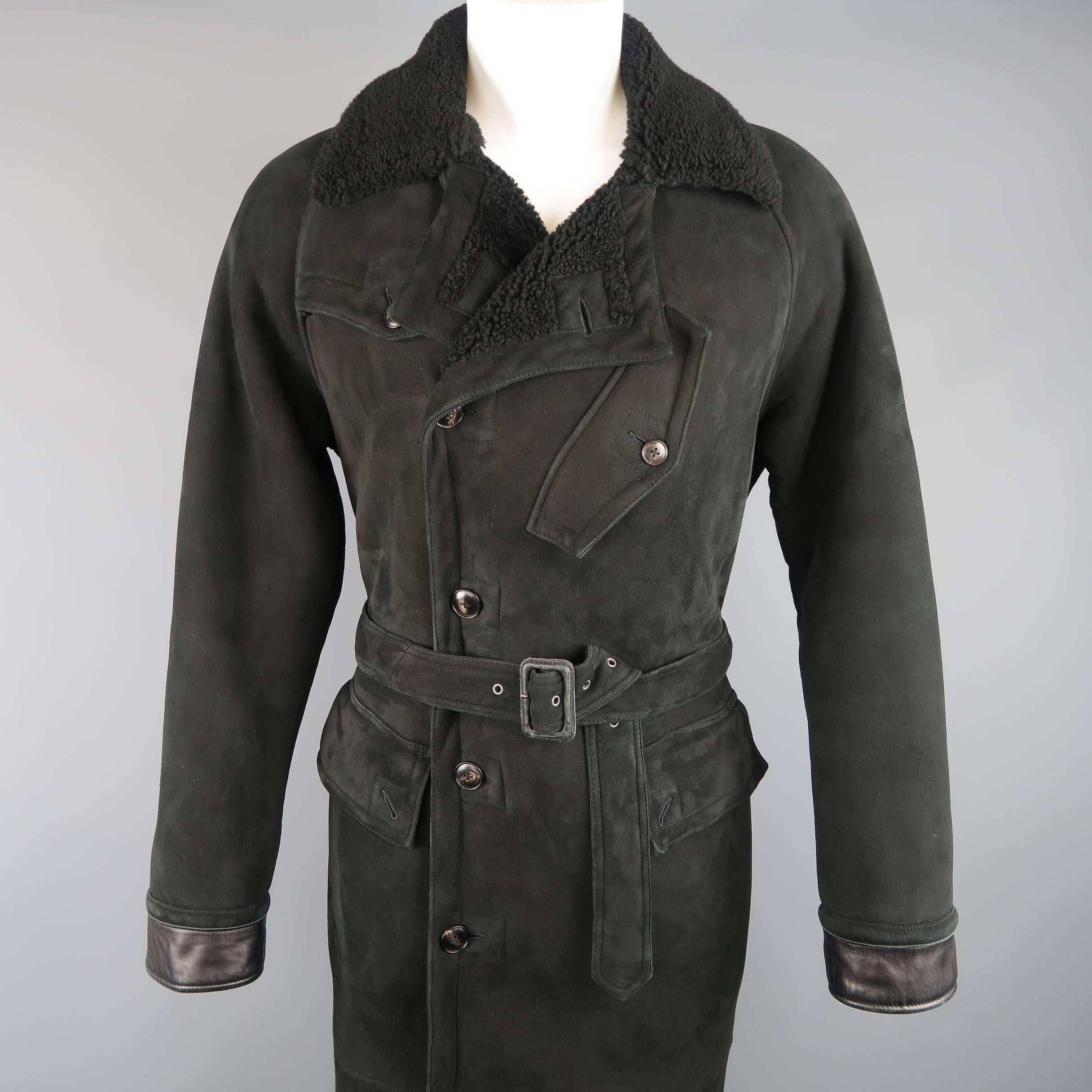 POLO RALPH LAUREN overcoat comes in black Italian Shearling and features a large pointed fur collar, double breasted button front, double flap pockets, slanted chest pocket, storm flap, leather cuffs, fulll fur lining, and belted waist. Wear