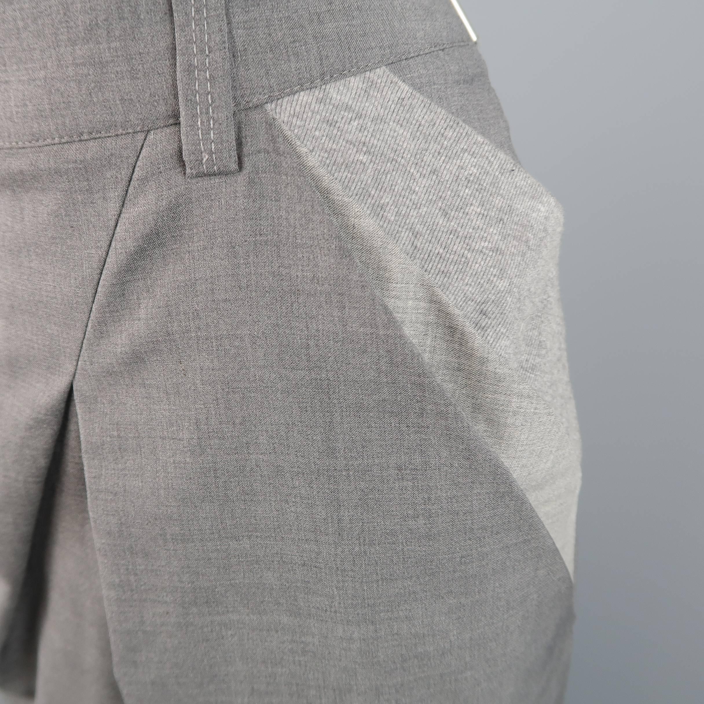 BRUNELLO CUCINELLI pencil skirt comes in heather gray wool and features a unique asymmetrical slanted pleat front with light gray ribbed knit color block panels. Made in Italy.
 
Excellent Pre-Owned Condition.
Marked: 4
 
Measurements:
 
Waist: 30.5