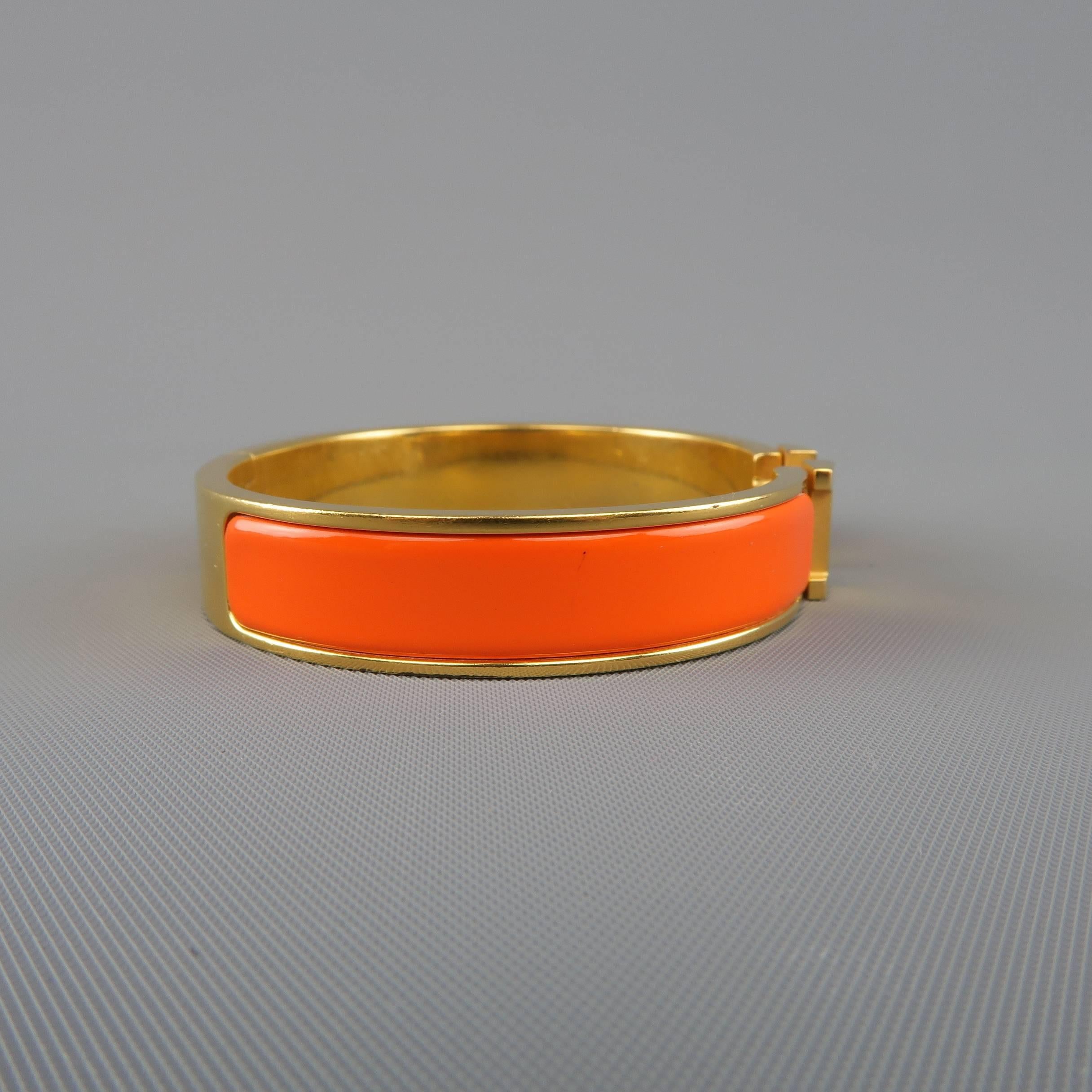 orange and gold hermes bracelet