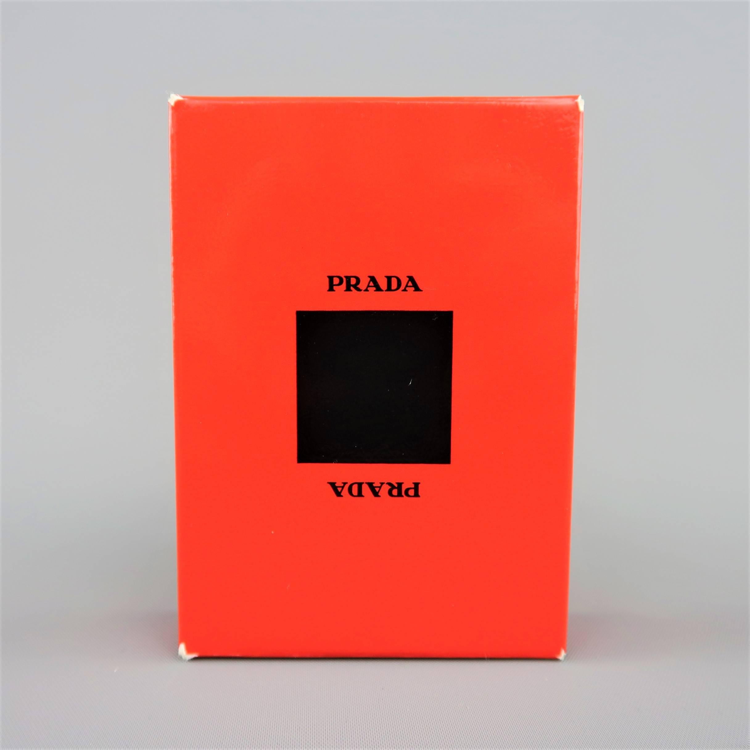 PRADA playing cards come sealed in a bold red logo case with original box. Come minor wear on corners of box from storage. As-Is. Made in Italy.
 
New in Box.
 
2.5 x 3.5 in.


SKU: 85382