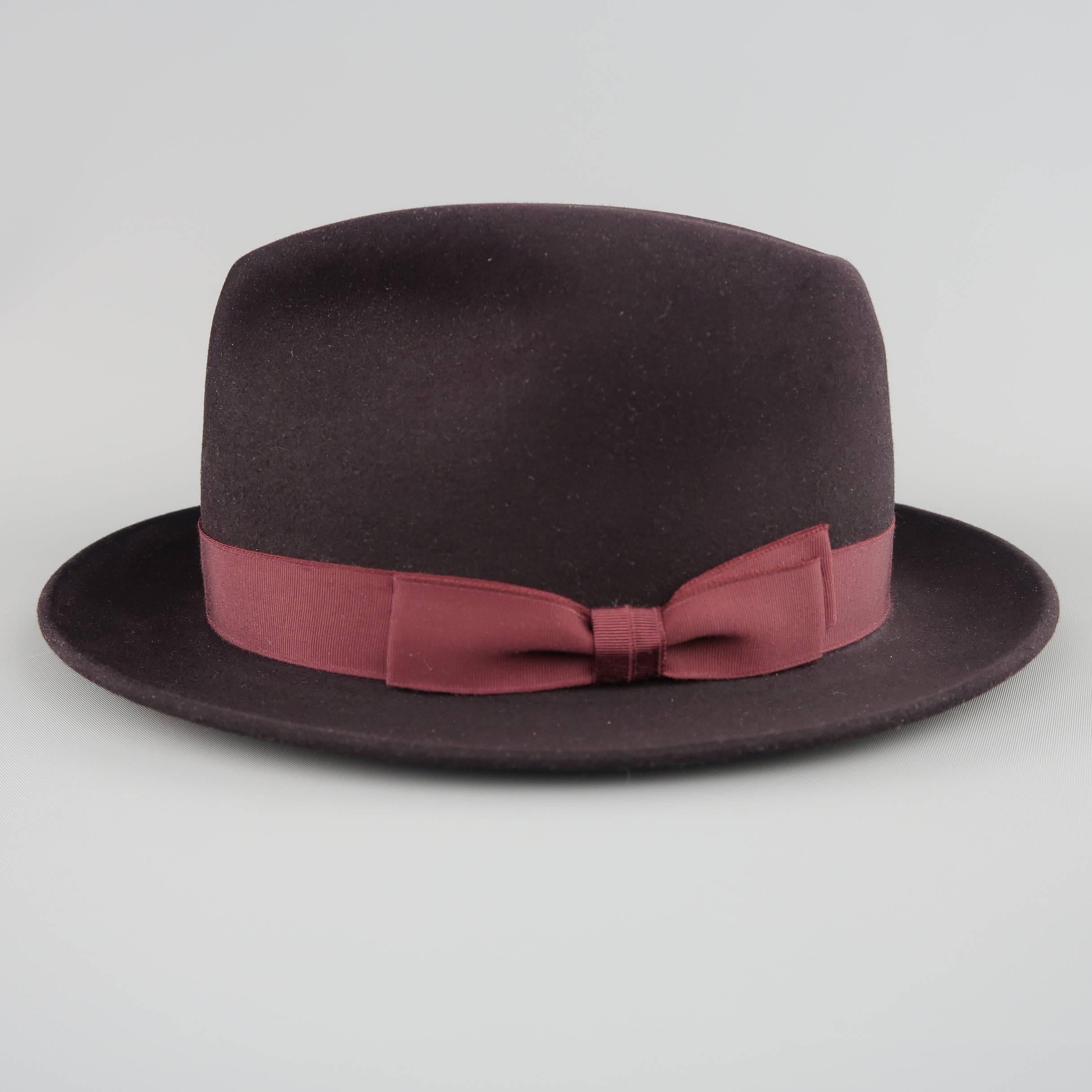 OPTIMO  fedora comes in eggplant purple felt with burgundy faille grosgrain ribbon. Includes original box.
 
Excellent Pre-Owned Condition.
Marked: 60
 
Size: 7 1/2
Brim: 2 in.


SKU: 85255