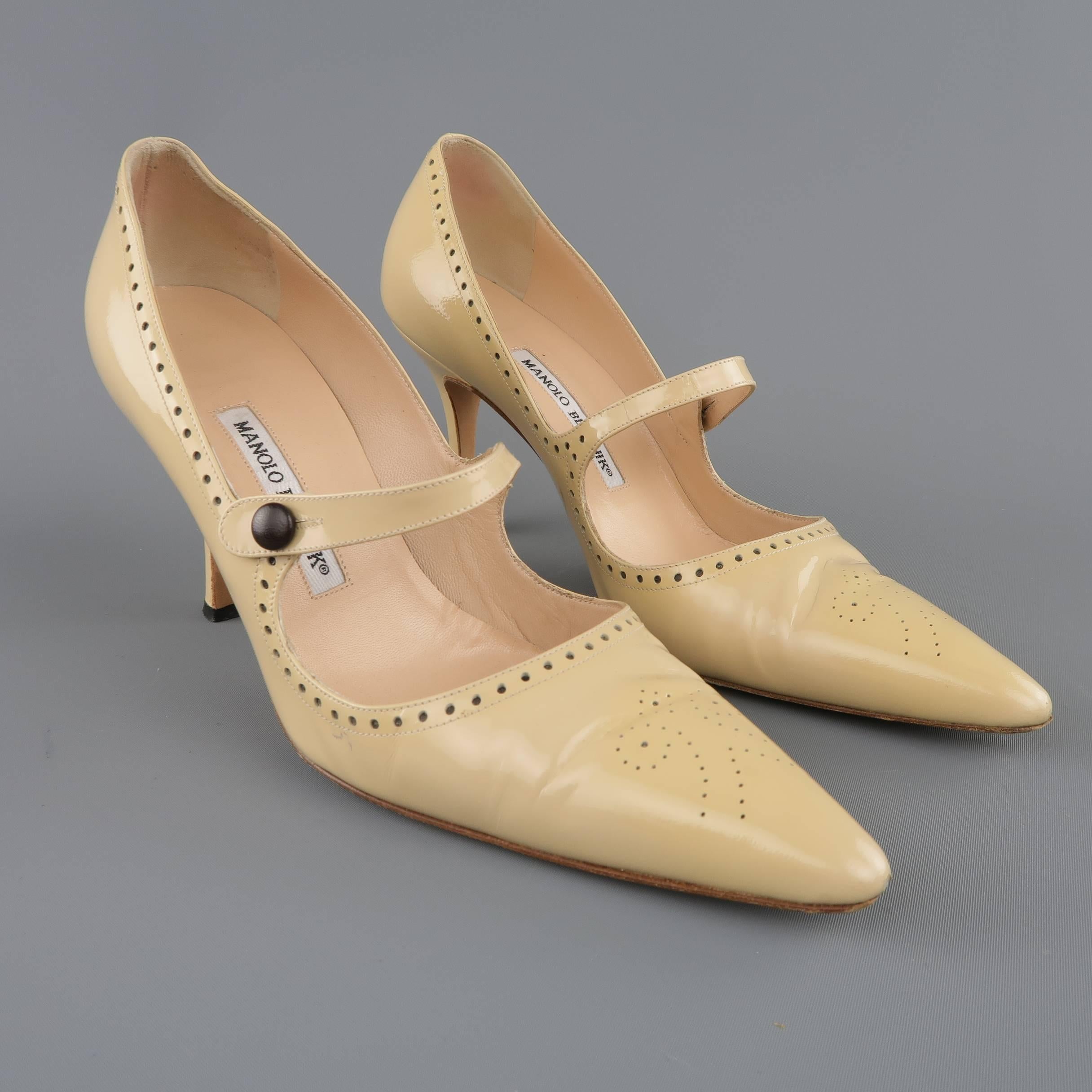 MANOLO BLAHNIK pumps come in light beige patent leather and feature a pointed toe with perforated brogue detail, covered stiletto heel, Mary Jane strap, and perforated trim. With box. Made in Italy.
 
Good Pre-Owned Condition.
Marked: IT 38.5
