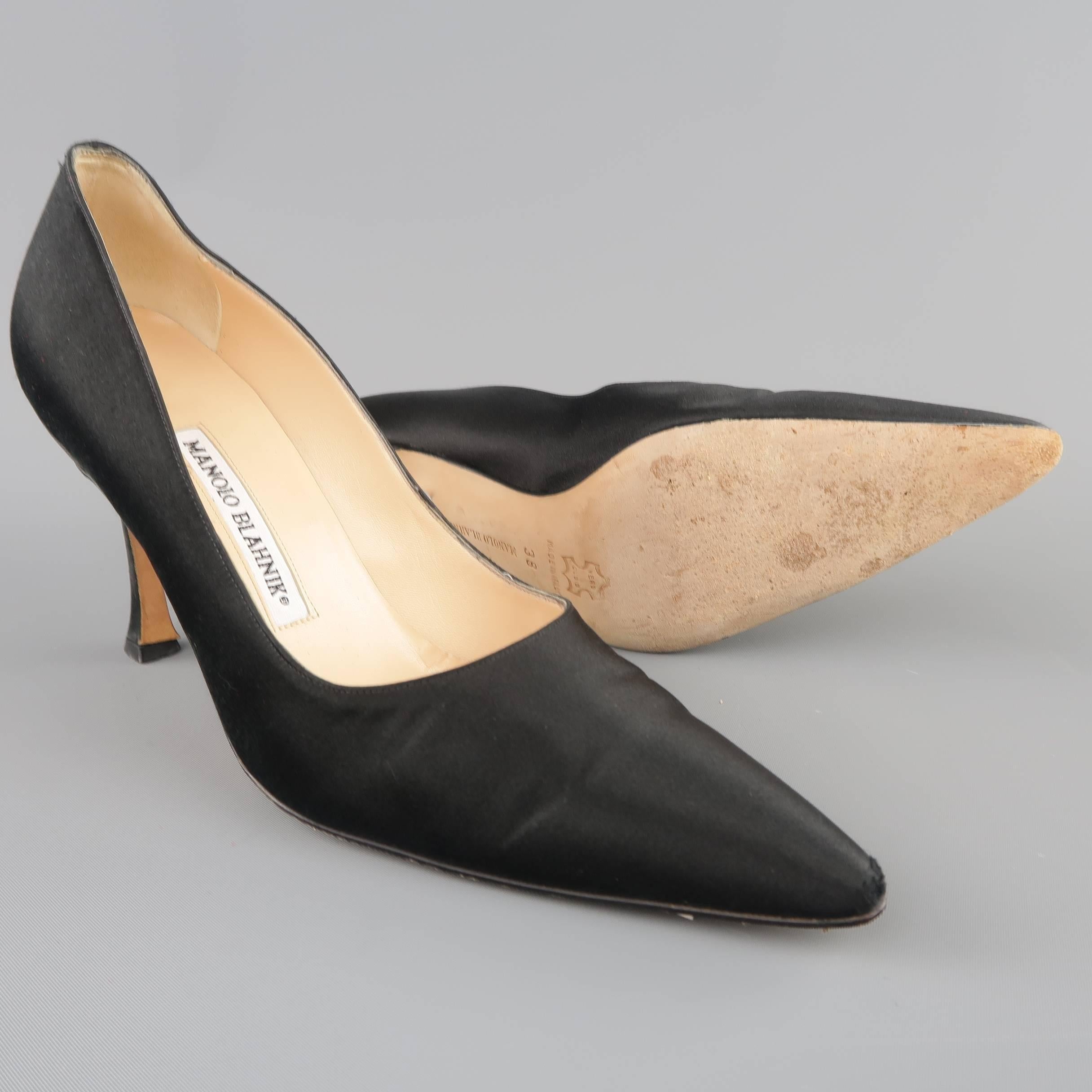 MANOLO BLAHNIK pumps come in black silk satin and feature a pointed toe and covered stiletto heel. Wear on toe. As-Is. With Box. Made in Italy.
 
Good Pre-Owned Condition.
Marked: IT 38
 
Heel: 3.5 in.


SKU: 80056