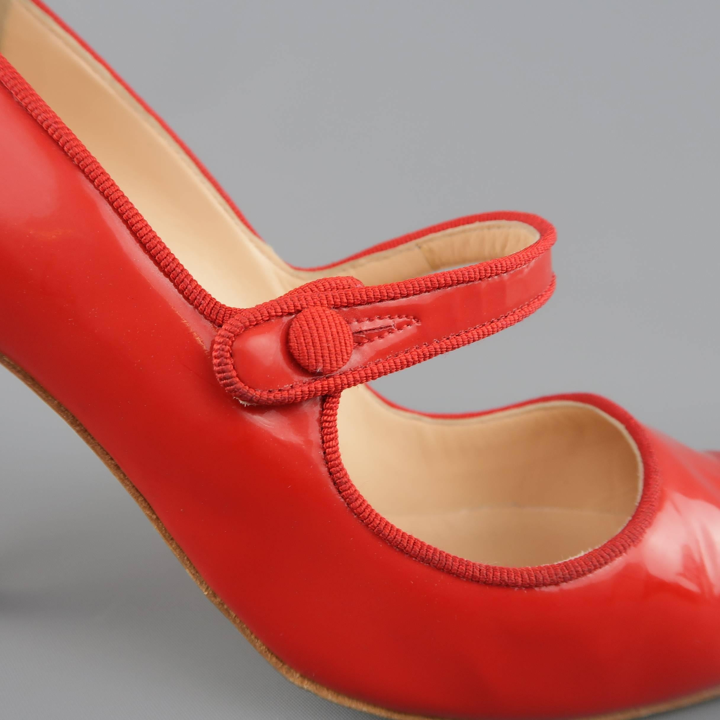 MANOLO BLAHNIK puymps come in semi matte bold red patent leather and feature a signature pointed toe, covered stiletto heel, faille piping and Mary Jane strap. Minor wear. With box. Made in Italy.
 
Good Pre-Owned Condition.
Marked: IT 39
