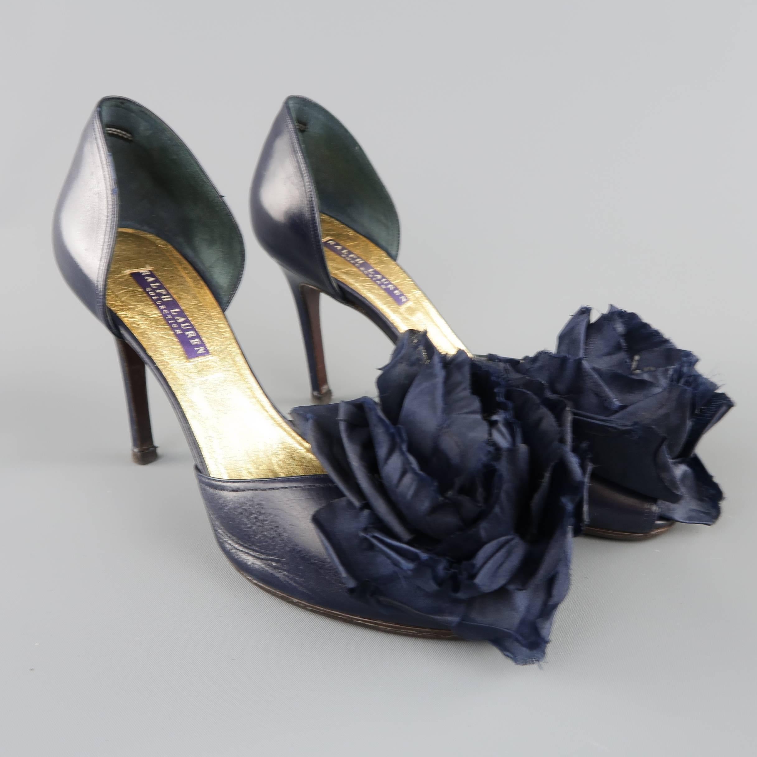 RALPH LAUREN COLLECTION D'orsay pumps come in navy blue leather and feature a peep toe, covered stiletto heel, and oversized flower adornment. Made in Italy.
 
Good Pre-Owned Condition.
Marked: 8 1/2 B
 
Heel: 3.75 in.

SKU: 84907