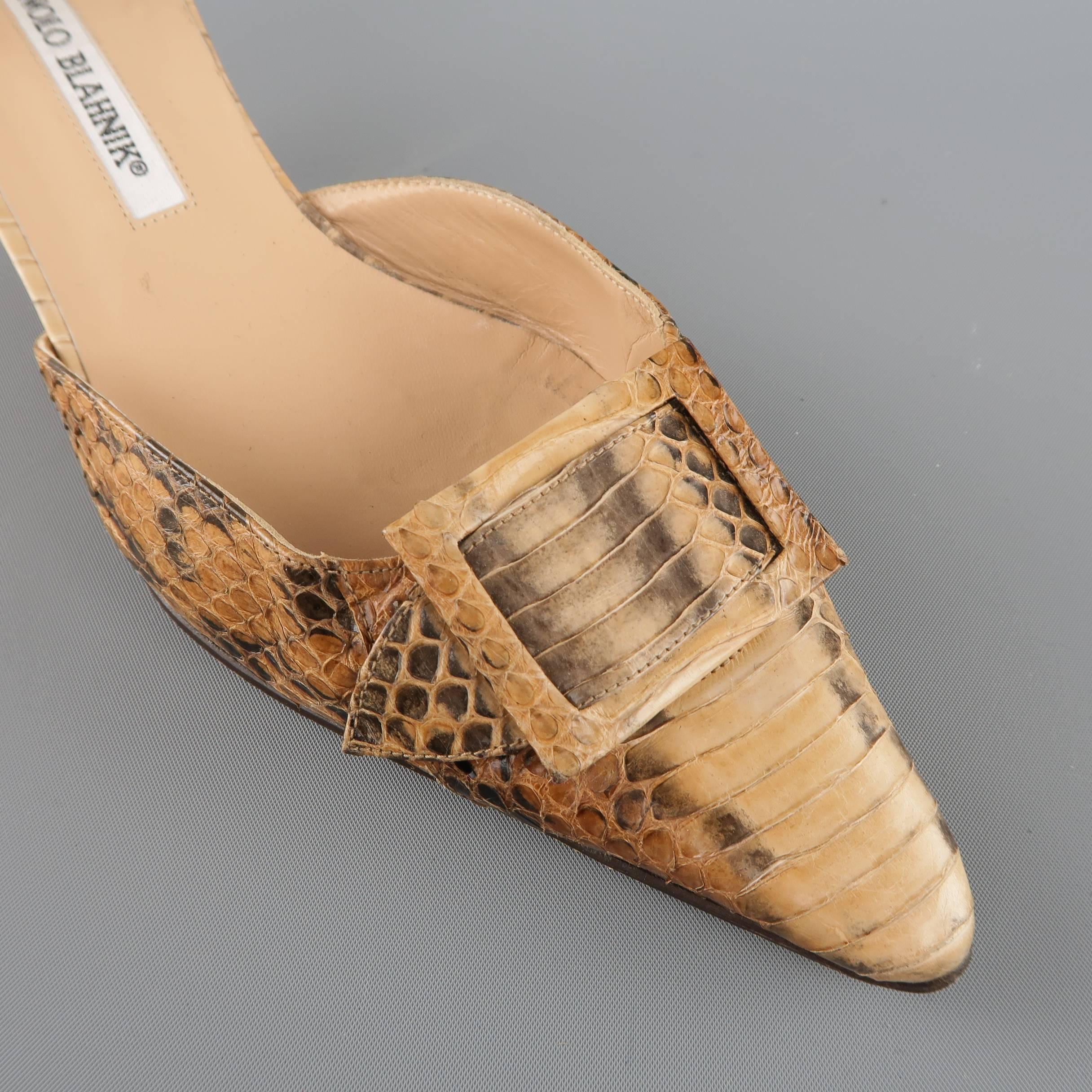 MANOLO BLAHNIK Tonodo d'orsay pumps come in tan snakeskin and feature a pointed toe, covered buckle strap detail, and covered kitten heel. With box. Made in Italy.
 
Good Pre-Owned Condition.
Marked: IT 3
 
Heel: 2 in.


SKU: 84453