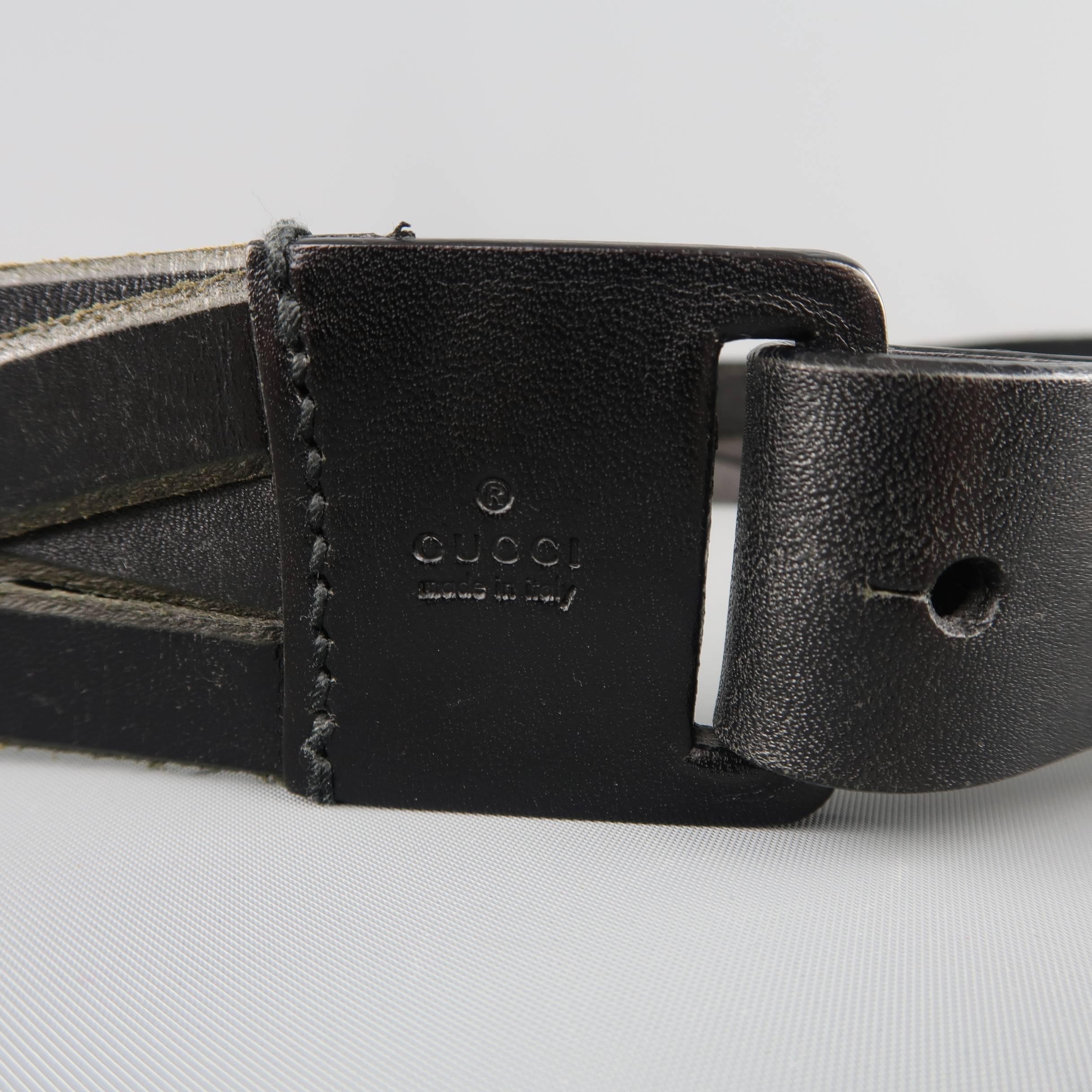 GUCCI belt features a braided woven black leather strap with embossed leather buckle and button stud closure. Made in Italy.
 
Good Pre-Owned Condition.
Marked: 85.34
 
Length: 39 in.
Width: 1.65 in.
Fits: 34-36 in.


SKU: 85557