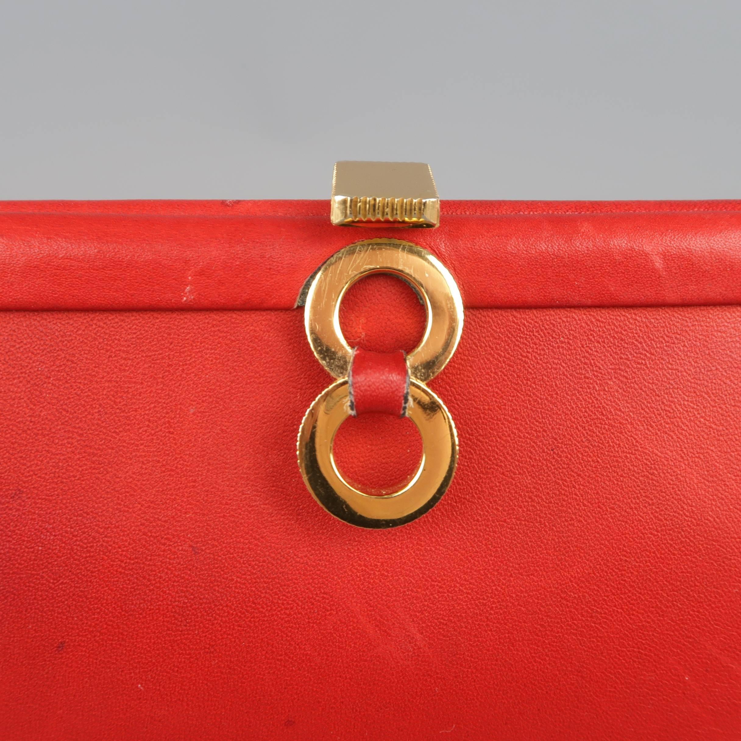 Vintage LOEWE purse comes in red leather and features yellow gold tone hoop adornment and clasp closure. Wear throughout. As-Is.
 
Fair Pre-Owned Condition.
 
Length: 5.75 in.
Width: 1 in.
Height: 4.25 in.

SKU: 85473