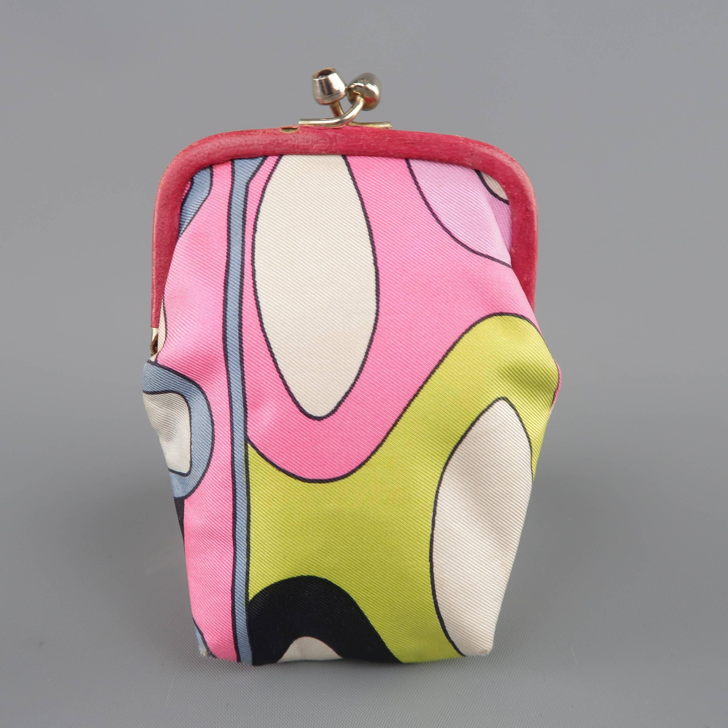 Vintage EMILIO PUCCI coin purse comes in signature geometric abstract print silk twill and features a leather trimmed, pink rhinestone kiss lock closure and pink lining. Wear throughout. As-Is. Made in Italy.
 
Fair Pre-Owned Condition.
