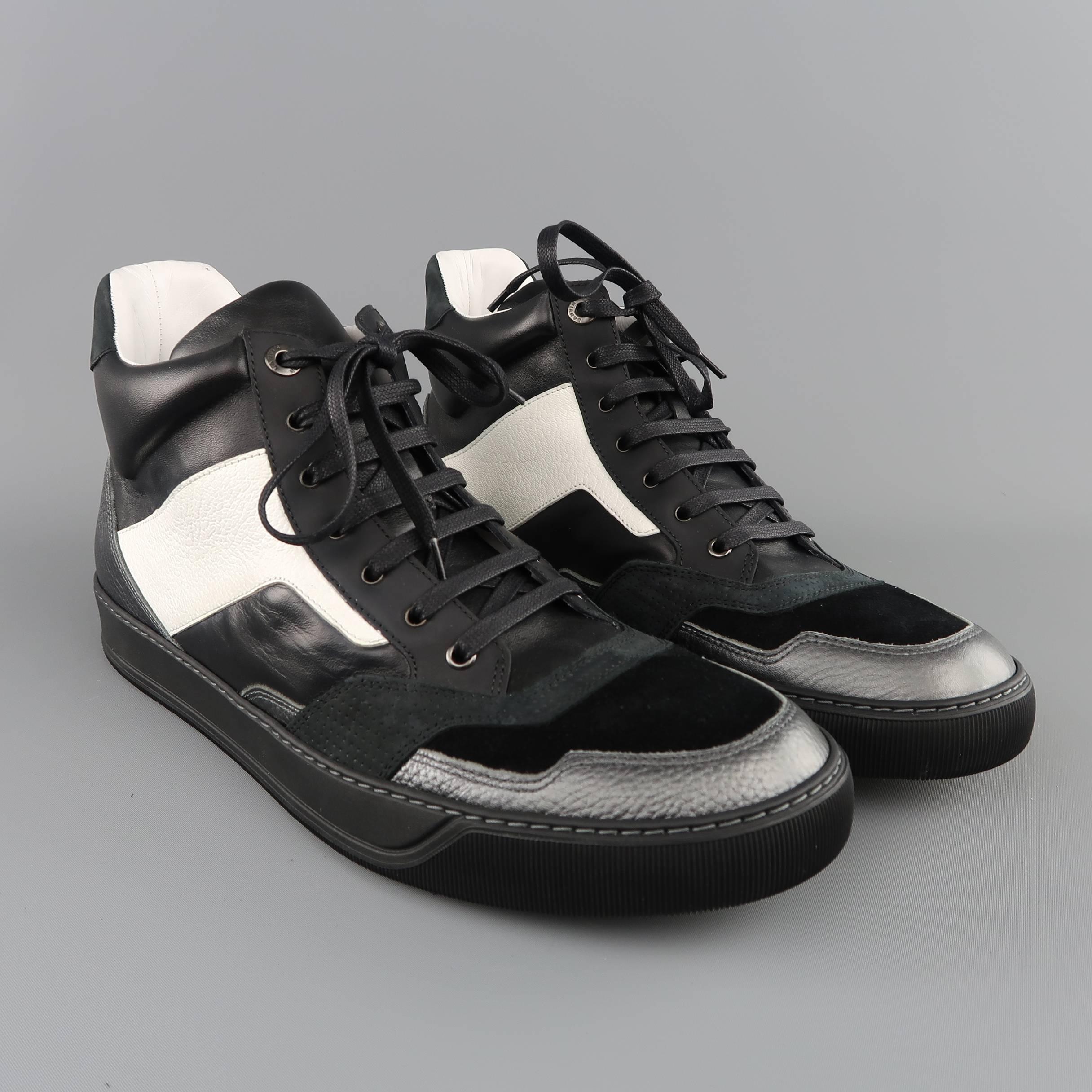 LANVIN high top sneakers come in smooth black leather with panels of rubber, smoke metallic silver leather, black suede, and pearlescent white textured leather. Made in Italy. With box.
 
Excellent Pre-Owned Condition.
Marked: 11
 
Outsole: 12.5 x