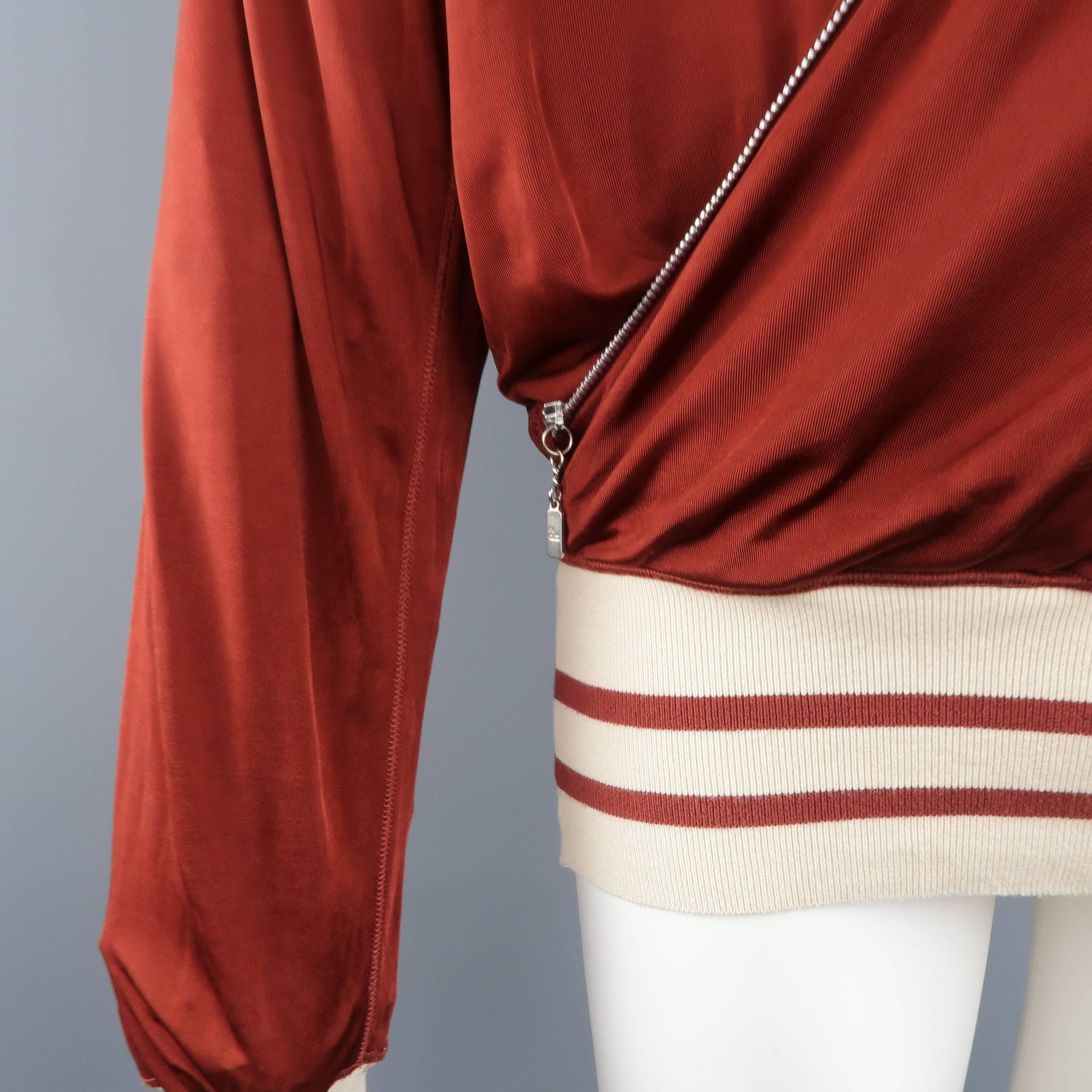 Vintage GAULTIER2 by JEAN PAUL GAULTIER pullover jacket comes in a silky rayon knit and features a wrap draped front with zipper trim, beige and burgundy striped knit bands, drawstring hood, and signature back tab. Minor wear. Made in Italy.
 
Good