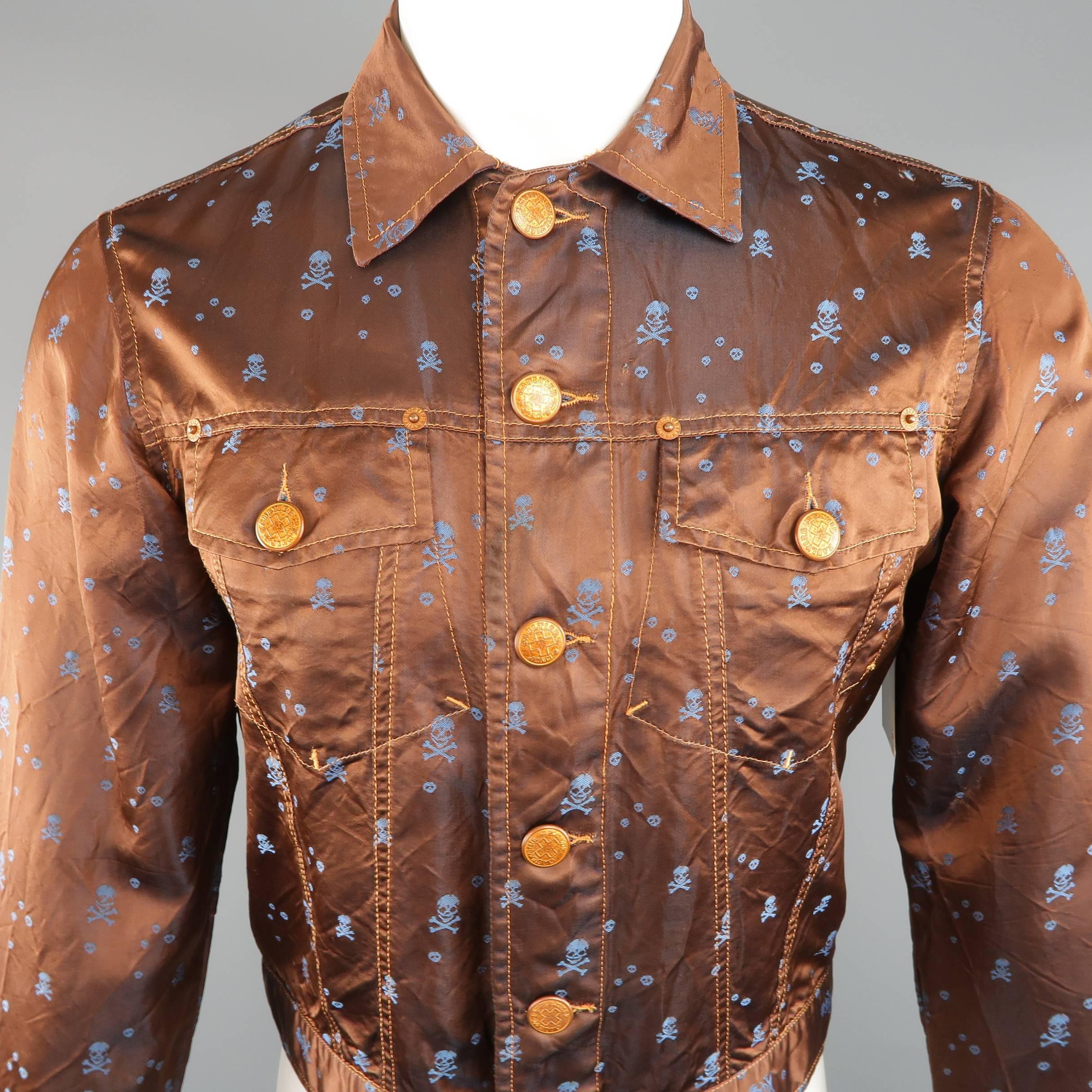 Vintage GAULTIER JEANS by JEAN PAUL GAULTIER trucker jacket comes in a metallic sheen copper wrinkled satin fabric with all over blue skull and crossbones print and features a pointed collar, patch flap chest pockets, cropped hem, oversized copper