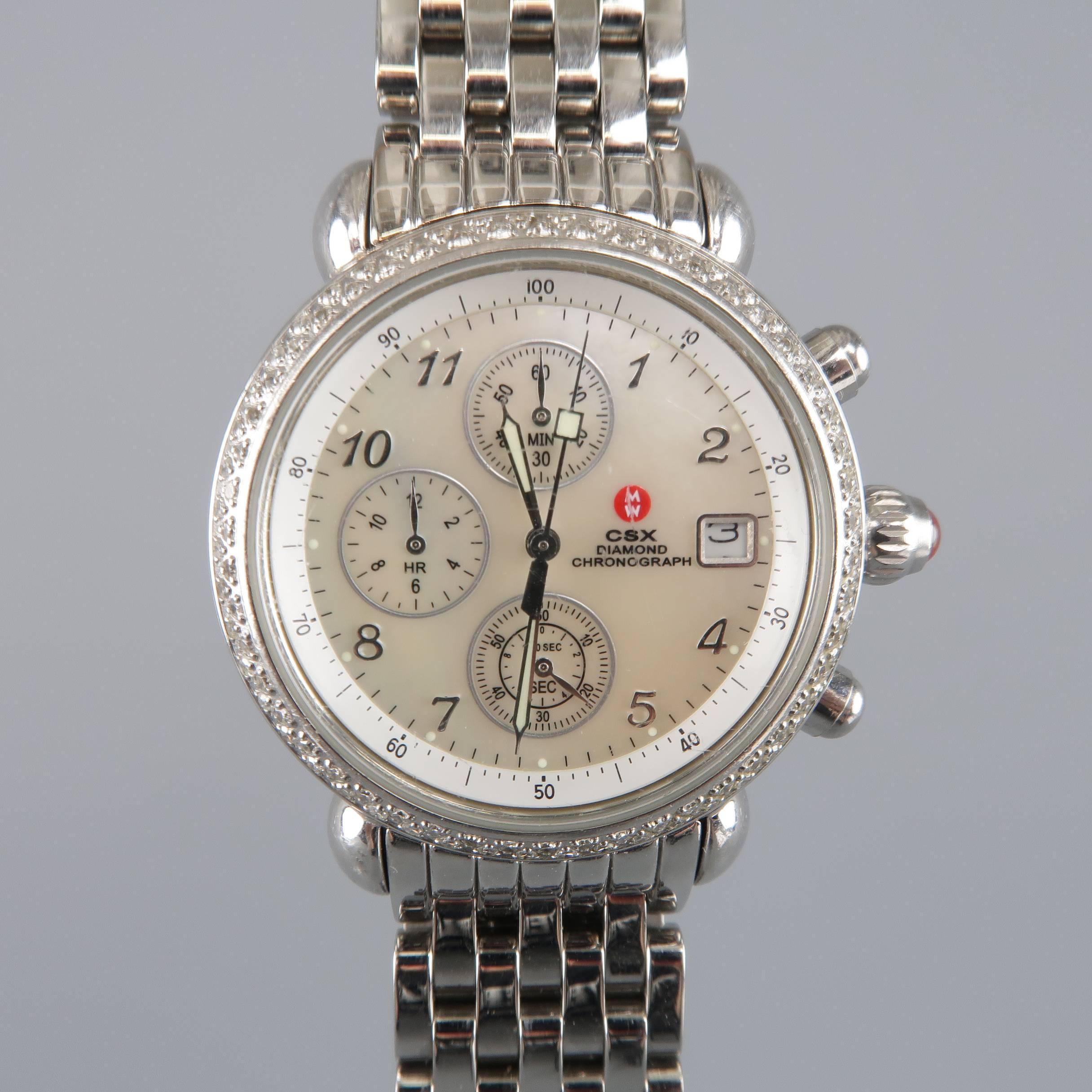 Michele Csx Diamond Chronograph  watch comes in silver tone stainless steel and features a round, mother of pearl clock face, with diamond frame. Includes five extra crocodile leather bands. Repaired and wear throughout bands. As-is. Includes