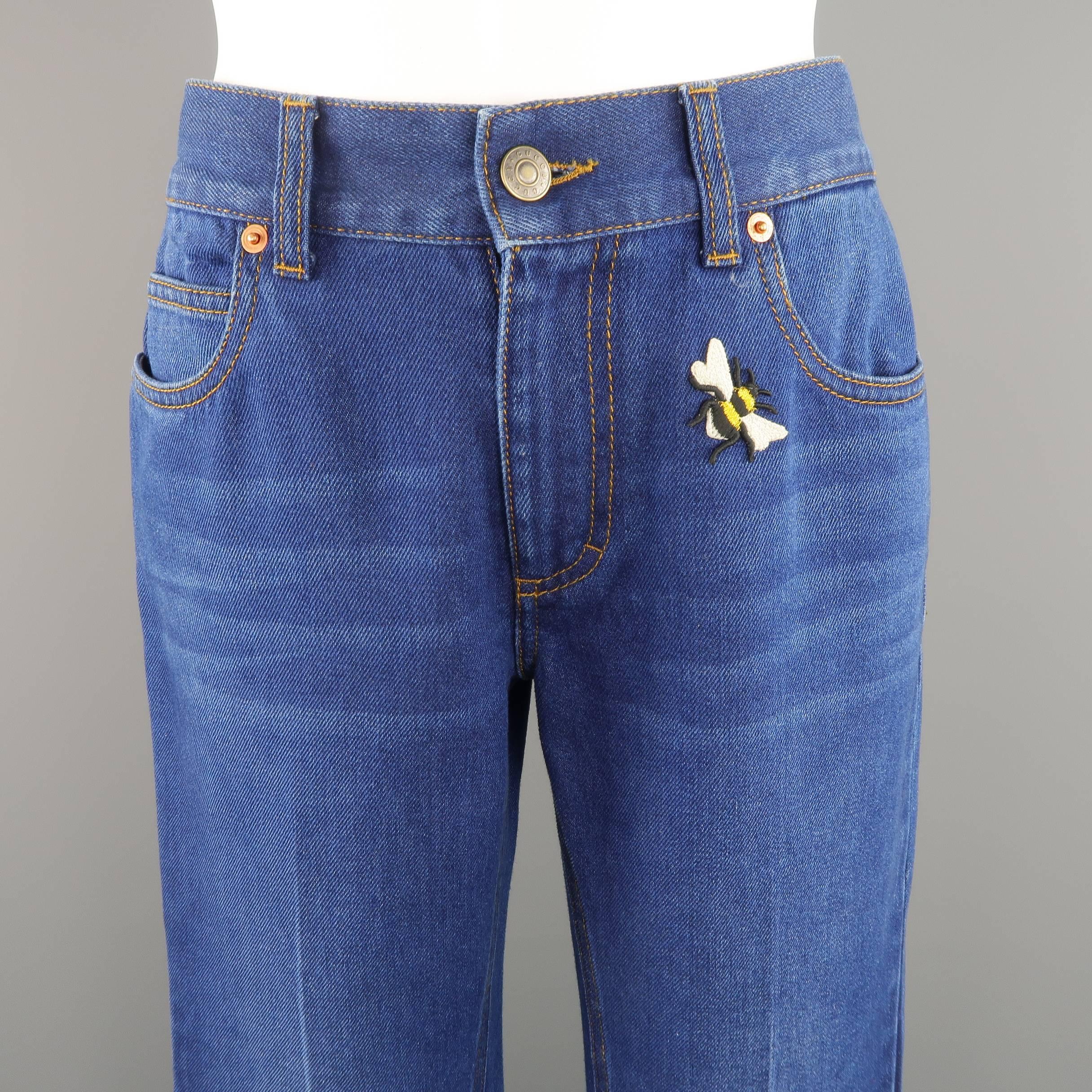 GUCCI jeans come in retro indigo blue washed denim and feature a wide, bell bottom silhouette, embroidered bumblebee on front, and oversized butterfly on back. Made in Italy.
 
Excellent Pre-Owned Condition. Retails $850.00
Marked: 25
