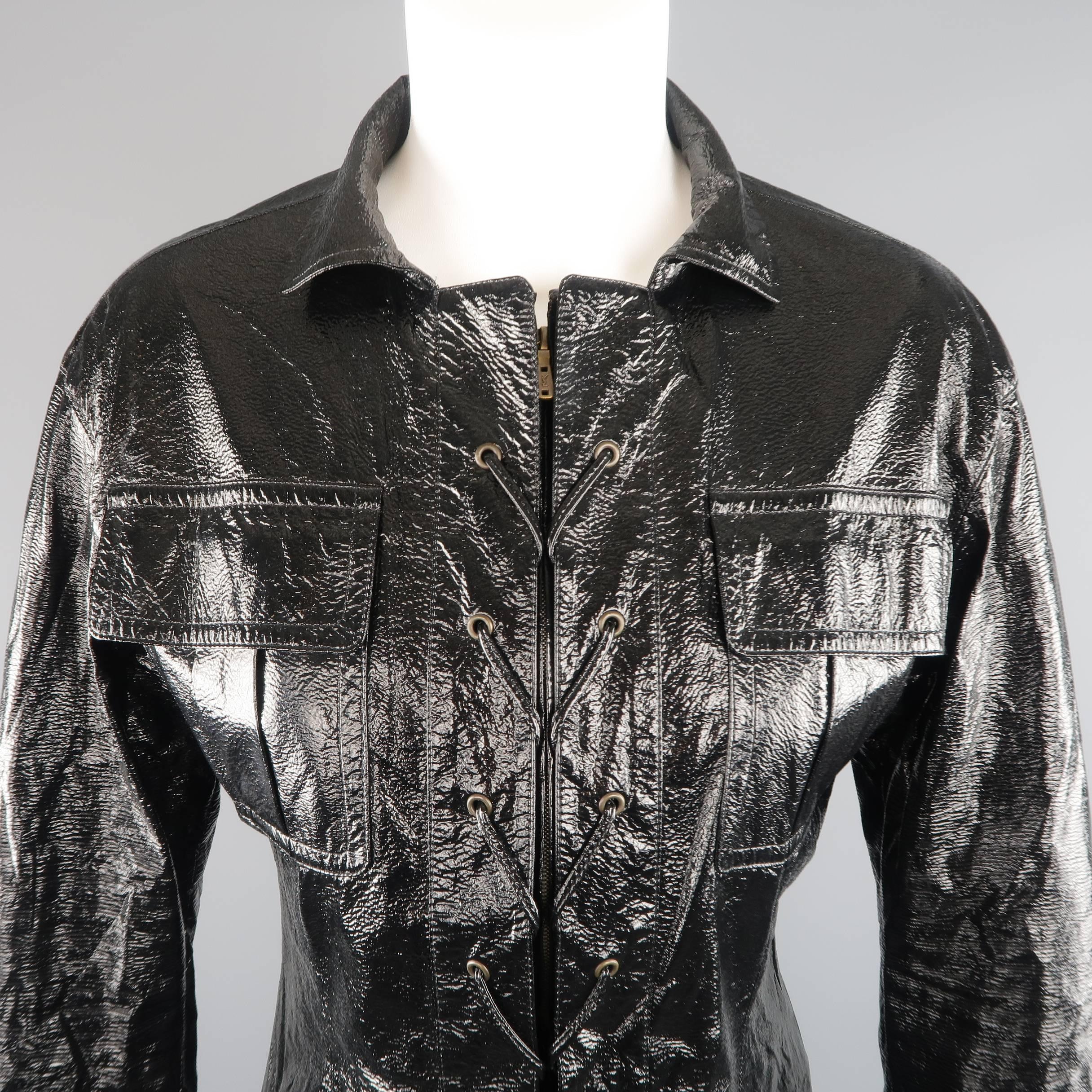 Inspired by a classic 1960's design, this TOM FORD era YVES SAINT LAURENT safari jacket comes in high gloss, wrinkle textured vinyl and features patch flap pockets, zip front with lace up placket detail, dark gold tone grommet hardware, and wide