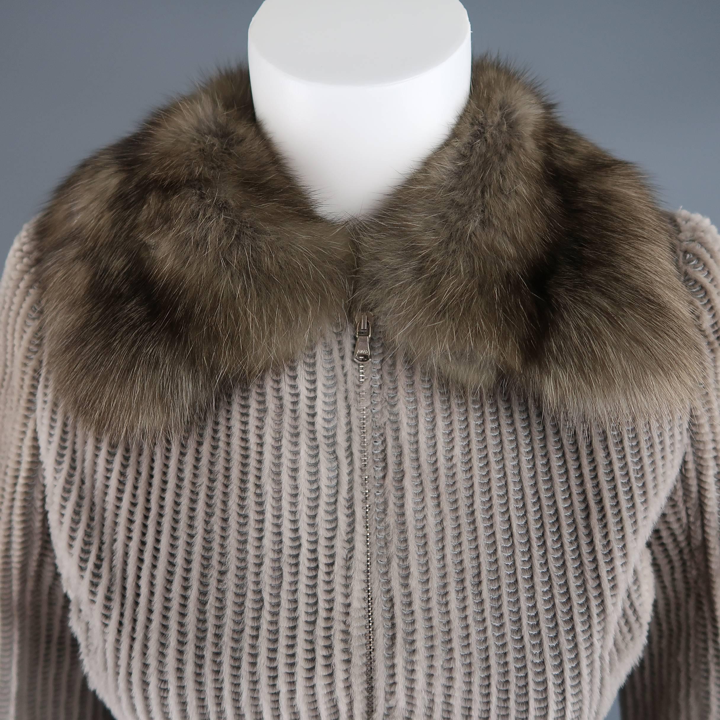 This fabulous custom Dennis Basso cocktail dress coat comes in taupe sheared mink with all over perforated texture and features a sable fur collar, zip front, beaded waistband and cuffs, silk satin liner, and box pleated A line skirt with partial