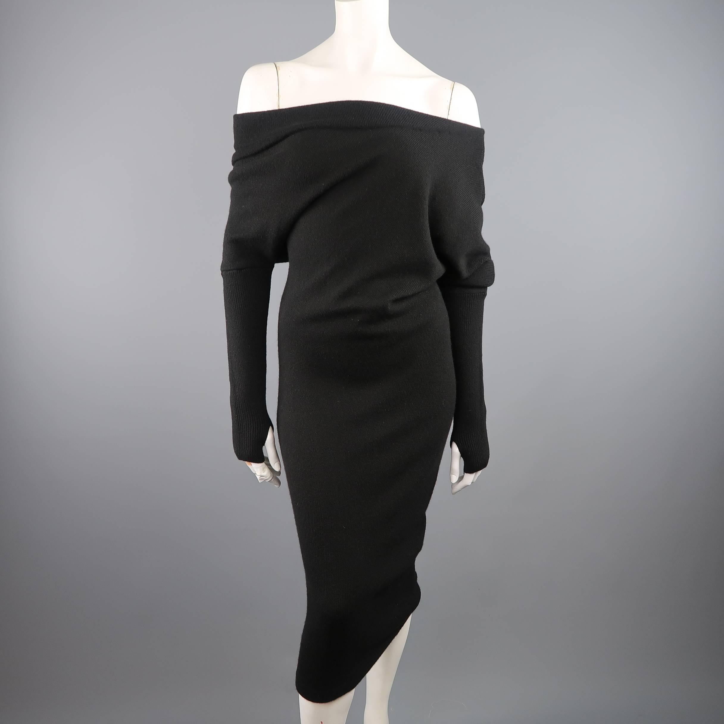 TOM FORD's fabulous sexy twist on a cozy sweater dress comes in thick black cashmere and features an asymmetrical, off one shoulder neckline, slouch draped mid section, fitted midi skirt, and long sleeves with thumb hole. Made in Italy.
 
New with