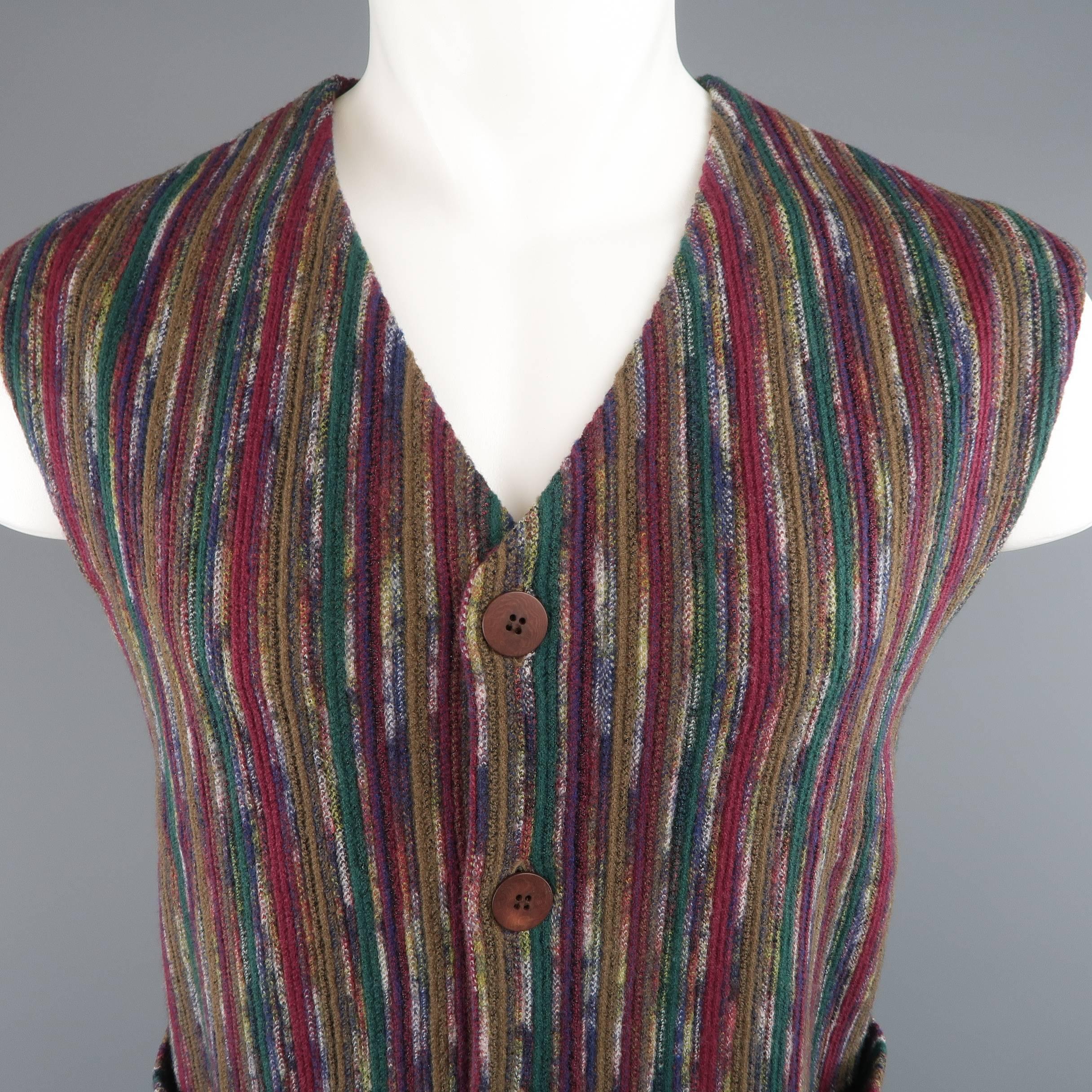 Vintage MISSONI vest comes in a multi color cranberry Earth tone stripe pattern wool blend knit with a V neck, slit pockets, and brown buttons. Missing bottom button. As-is. Made in Italy.
 
Good Pre-Owned Condition.
Marked: IT 52
 
Measurements:
