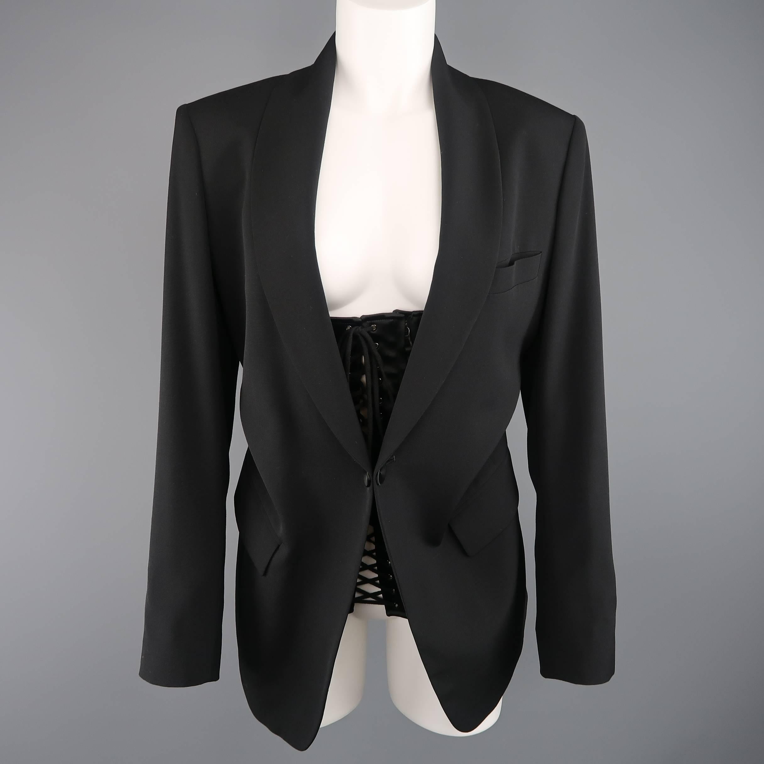 This fabulous JEAN PAUL GAULTIER jacket comes in a light weight black wool and features a shawl collar, single button front, functional button cuffs, and triple lace up satin bustier front with zip closure. Made in Italy.
 
Excellent Pre-Owned