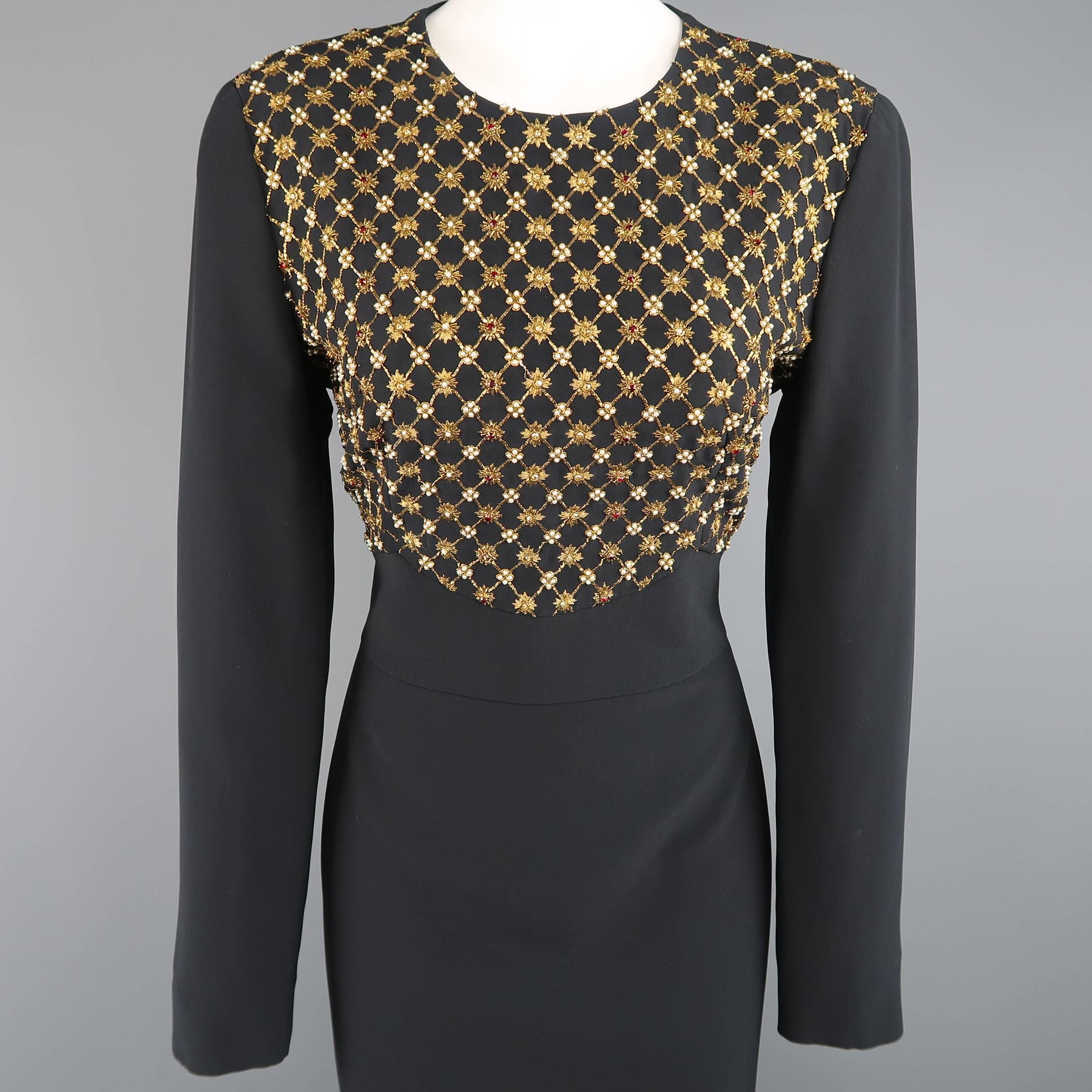 ALEXANDER MCQUEEN cocktail dress comes in black fabric and features a round neckline, long sleeves, midi pencil skirt, and beautiful gold embroidery with crystal and pearl beadwork throughout the chest. Hand crafted in Italy.
 
New with