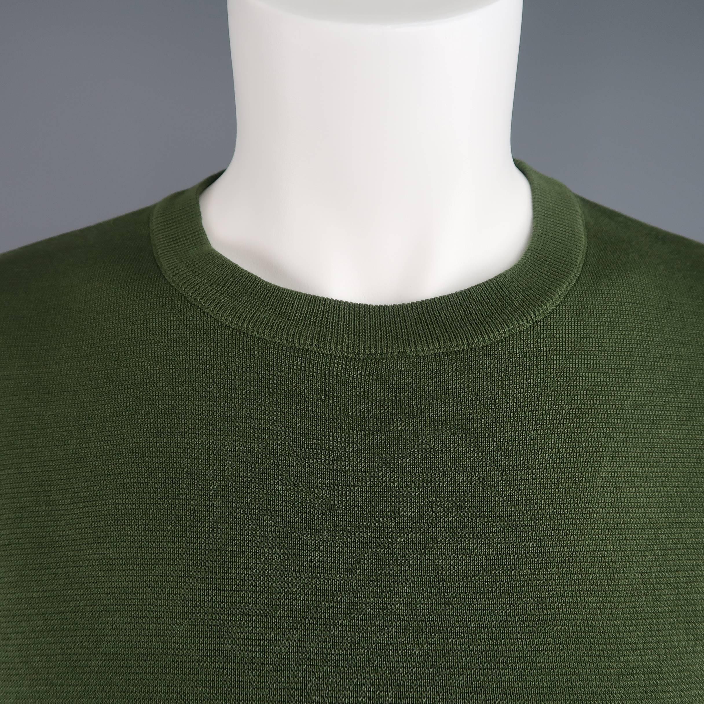 JIL SANDER pullover comes in a cotton knit and features a crewneck and boxy, drop shoulder short sleeves. Made in Italy.
 
New with Tags.
Marked: IT 48
 
Measurements:
 
Shoulder: 22 in.
Chest: 38 in.
Sleeve: 7 in.
Length: 22 in.

SKU: 86213