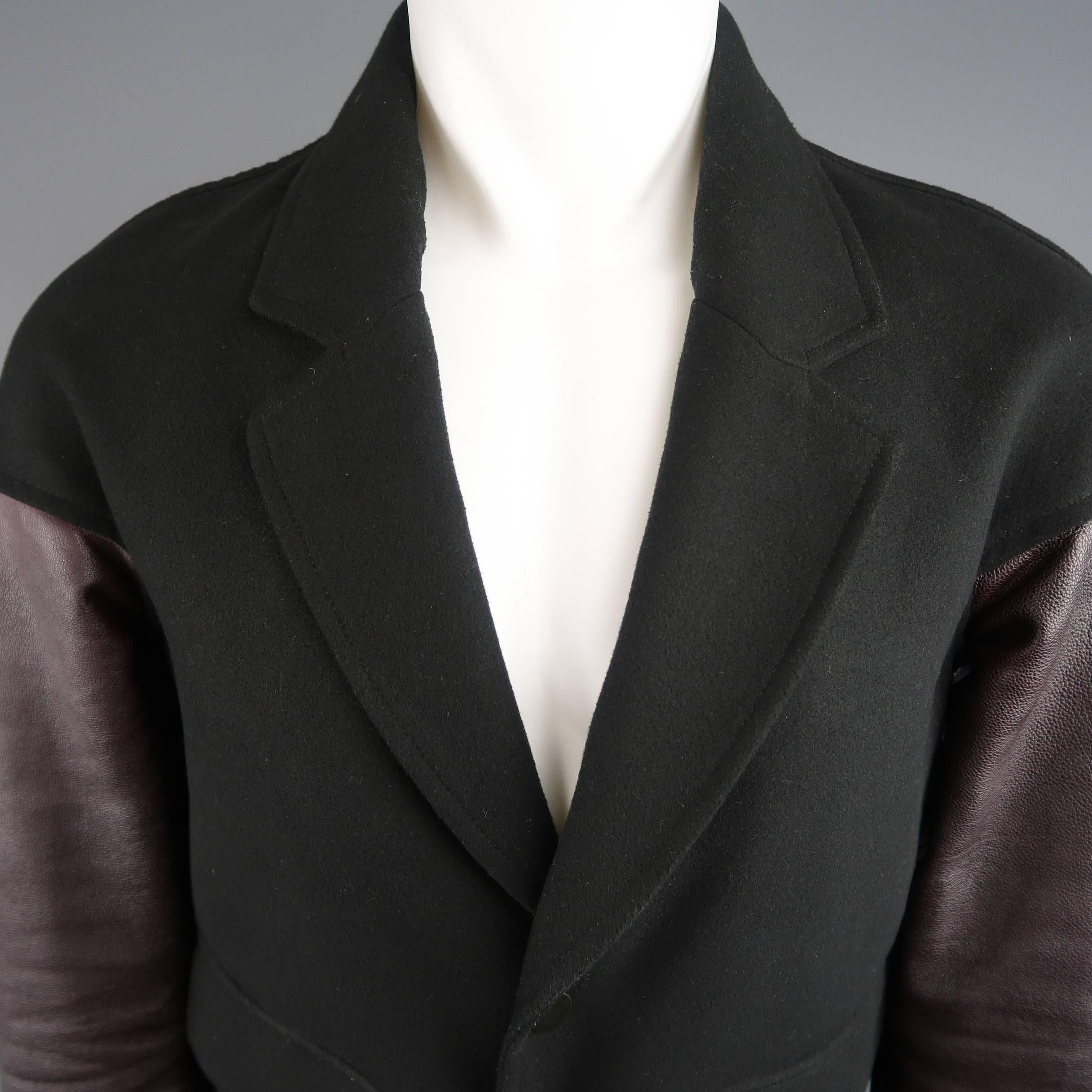ALEXANDER WANG bomber jacket comes in black wool felt and features a notch lapel, snap closure, flap pockets with diagonal slit, and burgundy leather baseball sleeves. Wear throughout.
 
Good Pre-Owned Condition.
Marked: XS
 
Measurements:
