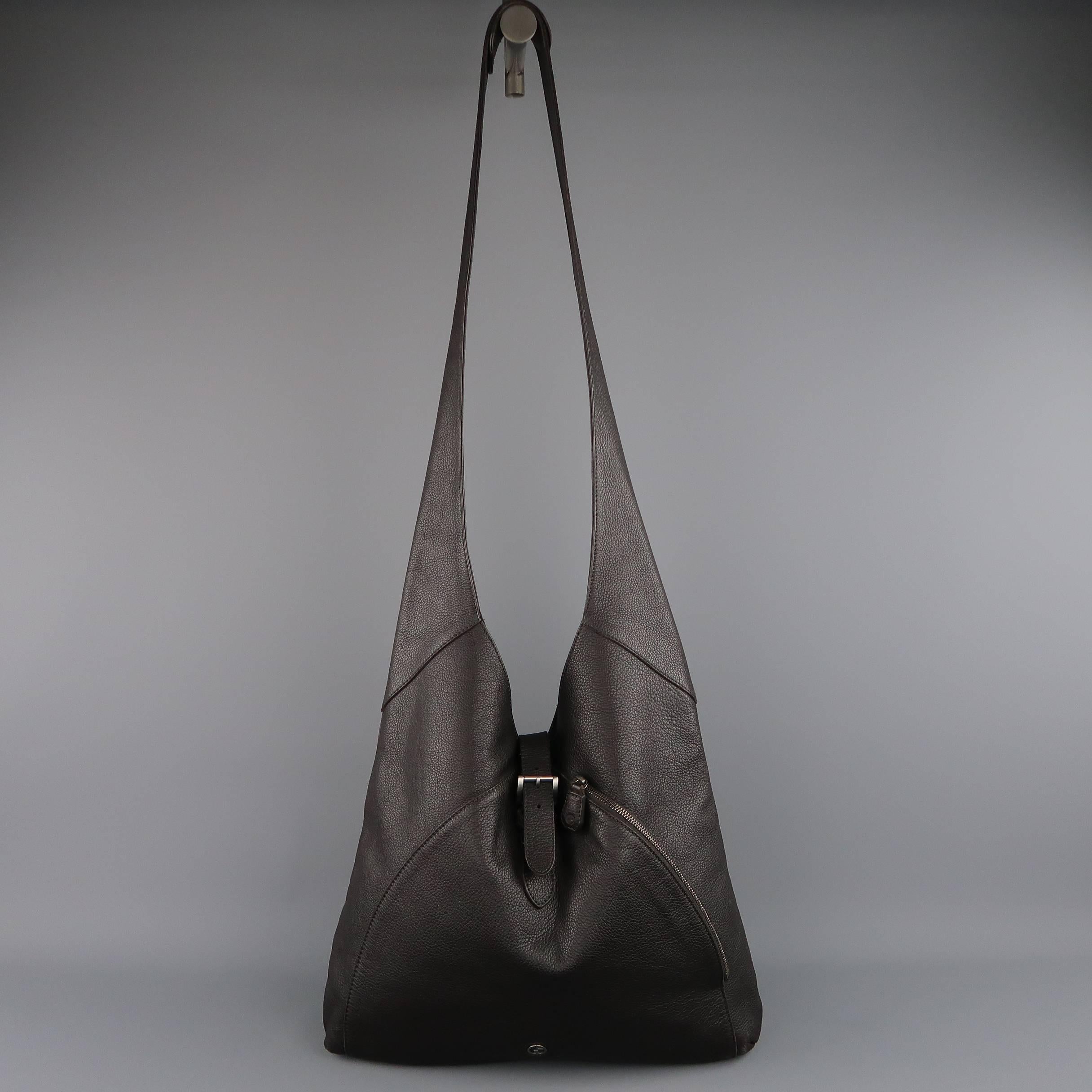 GIORGIO ARMANI bag comes in rich brown textured leather an features a silver tone logo plaque, side zip pocket, long shoulder crossbody strap and top buckle strap closure. Made in Italy.
 
Excellent Pre-Owned Condition.
 
Measurements:
 
Length: 15