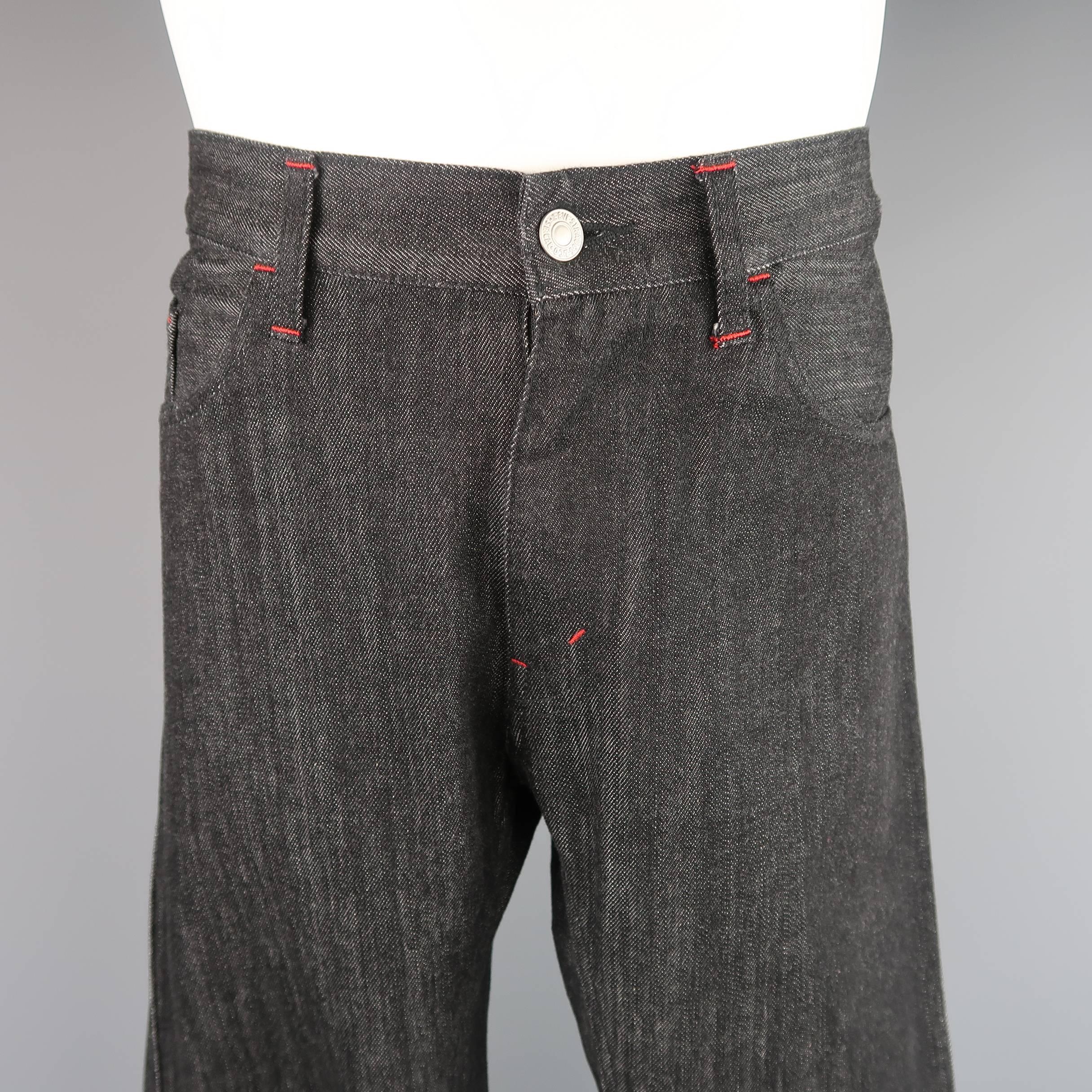 JUNYA WATANABE X LEVI'S jeans come in black raw denim and feature red contrast stitching, knee seams, and darted back seam. Made in Japan.
 
Excellent Pre-Owned Condition.
Marked: M (AD 2010)
 
Measurements:
 
Waist: 37 in.
Rise: 10 in.
Inseam: 31