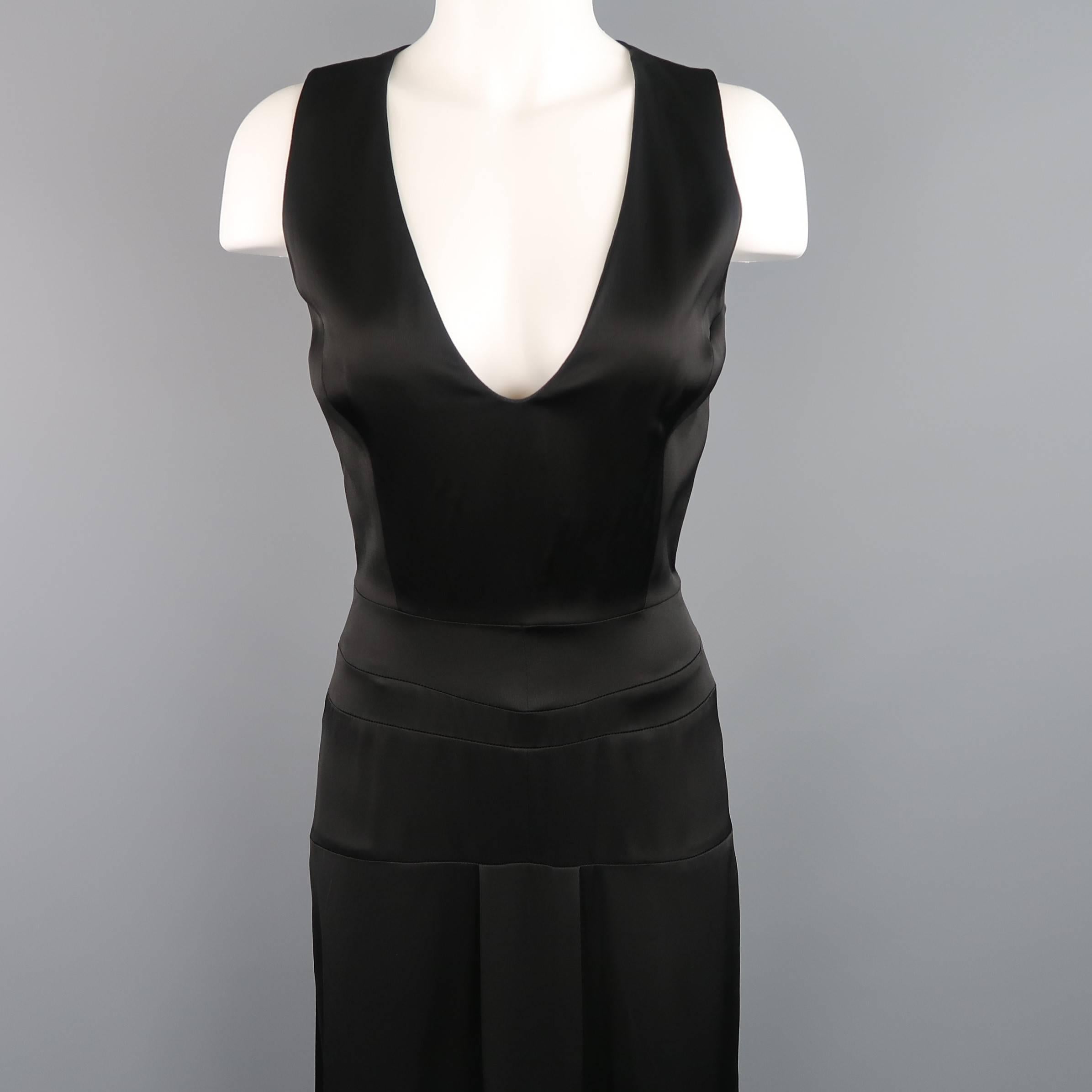VICTORIA BECKHAM sleeveless maxi dress comes in a semi shine twill and features a V neckline, cinched, corset seam waistband, shift skirt with box pleat and tied sash belt. Made in UK.
 
Retails: $6,400.00

Excellent Pre-Owned Condition. 
Marked: US