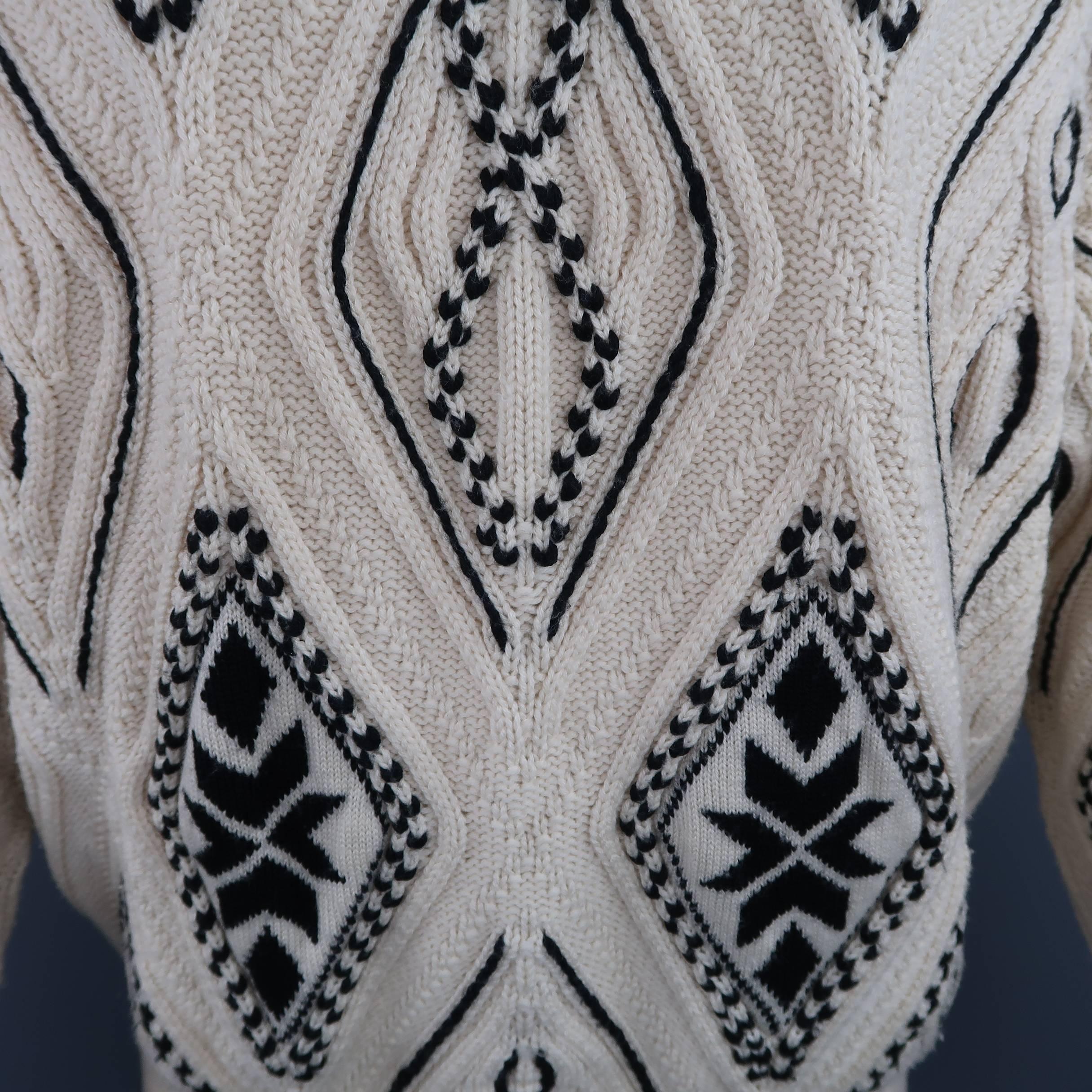 This vintage GIANFRANCO FERRE pullover sweater comes in a unique cream beige diamond knit with black pattern patches with a mock neck and drop shoulder sleeves. Hand Knitted. Made in Italy.
 
Good Pre-Owned Condition.
Marked: EU 50
 
Measurements:
