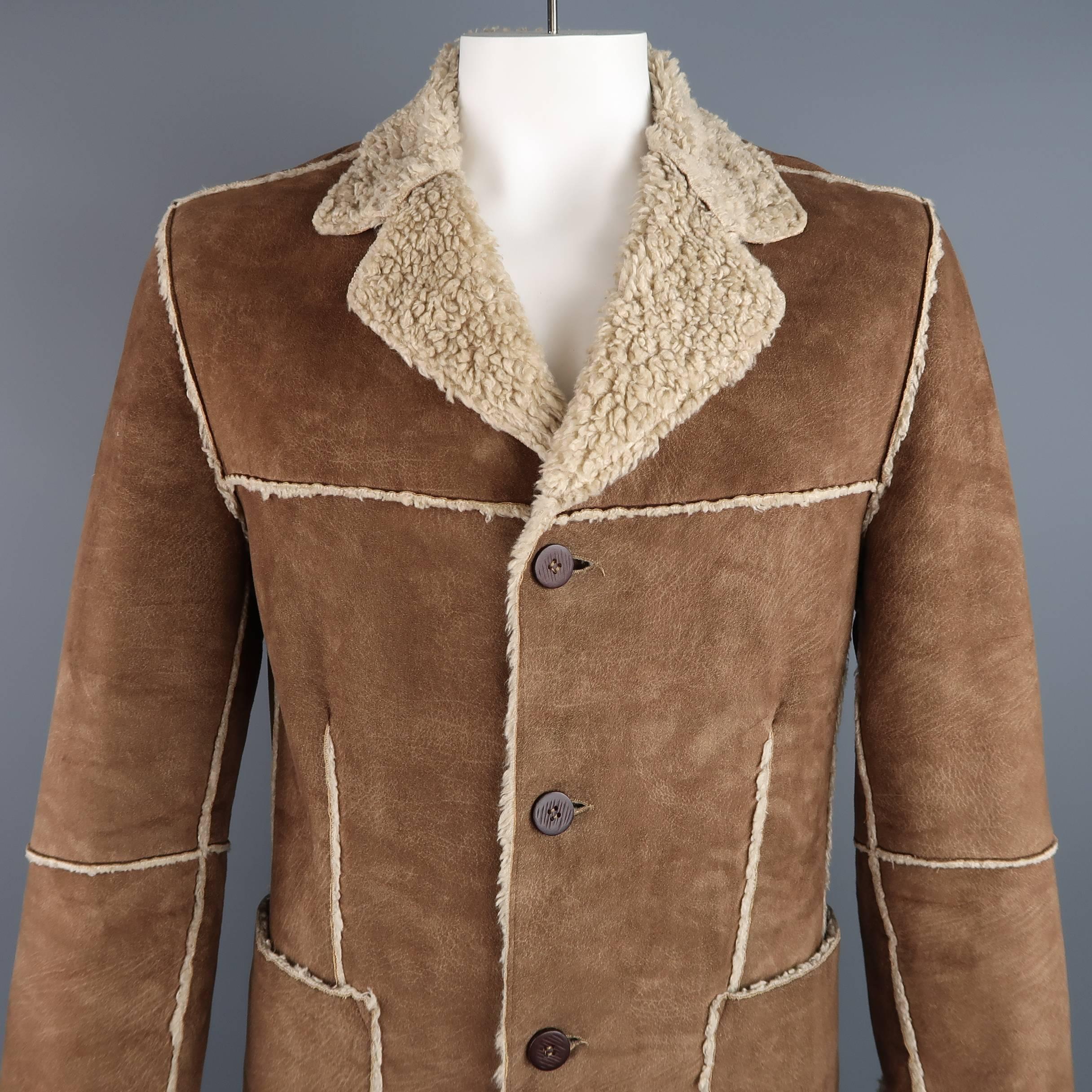 PRIMO EMPORIO coat comes in a light weight, tan faux vegan shearling and features a notch lapel, four button closure, patch pockets, and external reverse seams throughout. Made in Italy.
 
Good Pre-Owned Condition.
Marked: (no size)
 
Measurements:
