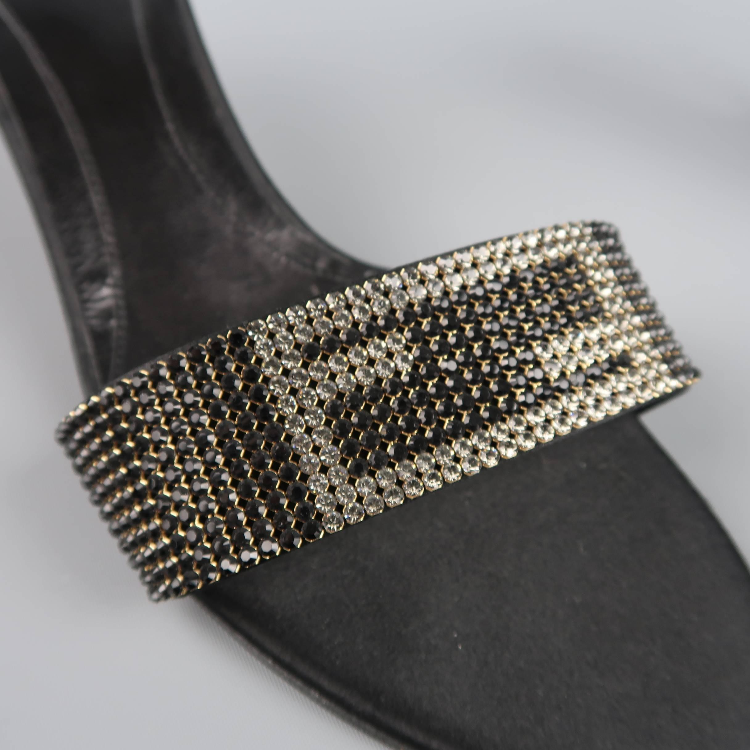 Archive FENDI mules feature a black silk satin and leather sole, silk covered kitten heel, and thick strap with black and silver rhinestone logo. Made in Italy.
 
Excellent Pre-Owned Condition.
Marked: IT 39.5
 
Measurements:
 
Heel: 2.75

SKU: 86821