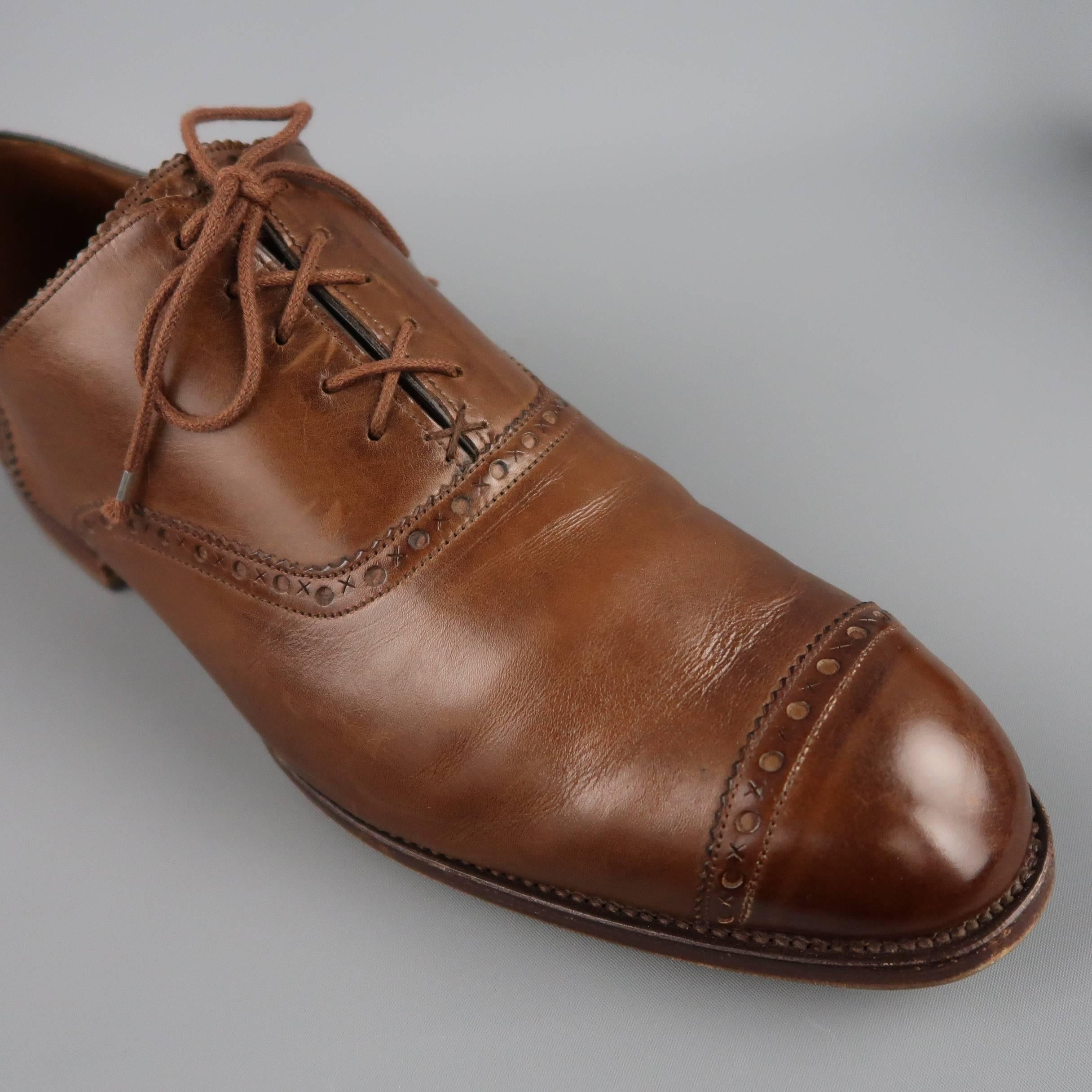 BARNER BLACK "CLIFTON" dress shoes come in a warm brown leather with a rounded point cap toe and signature X O perforated brogue piping. Resoled. With box. Made in England.
 
Good Pre-Owned Condition.
Marked:  UK 10.5
 
Outsole: 12.5 x 4