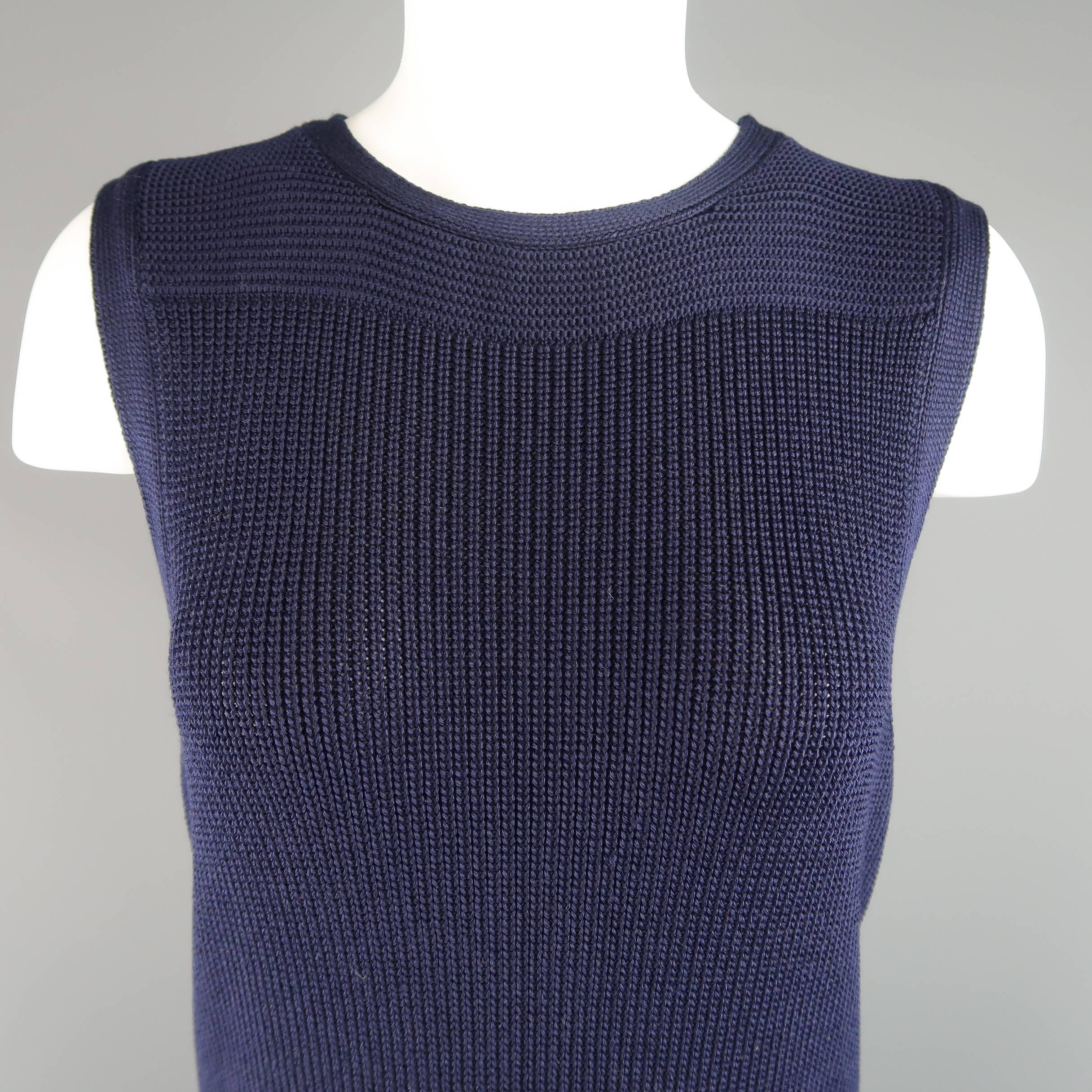 RALPH LAUREN Collection sweater vest top comes in navy blue silk blend textured knit and features a round neckline, extended length, and side slits. Wear throughout knit. Made in Italy.
 
Fair Pre-Owned Condition.
Marked: M
 
Measurements:
