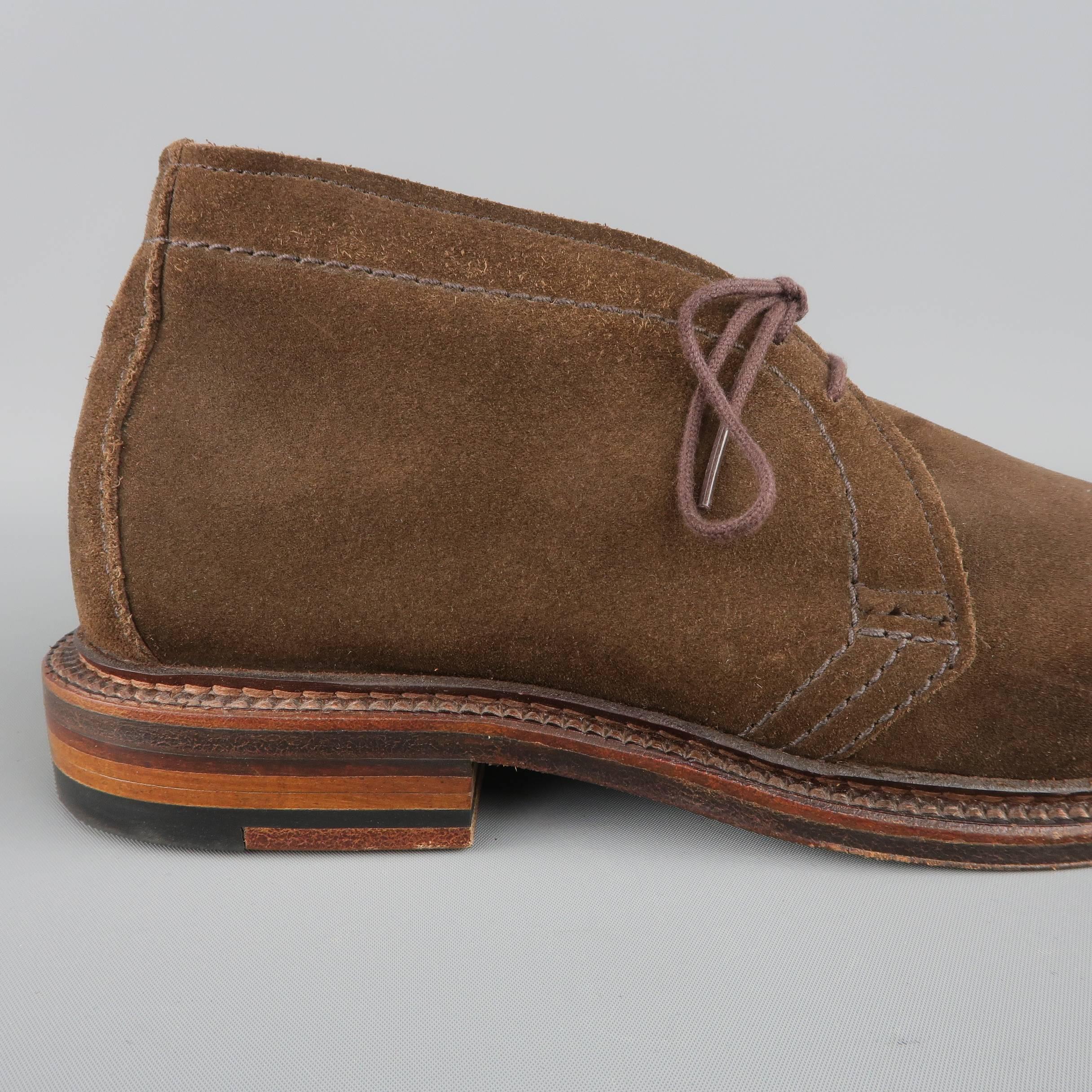 ALDEN ankle length desert chukka style boots come in chocolate brown suede with a stacked leather heeled sole. Discolorations on sides from storage. Never worn. As-Is. Made in USA.
 
Brand New with Defect.
Marked: 7.5
 
Outsole: 11.5 x 4 in.
Height:
