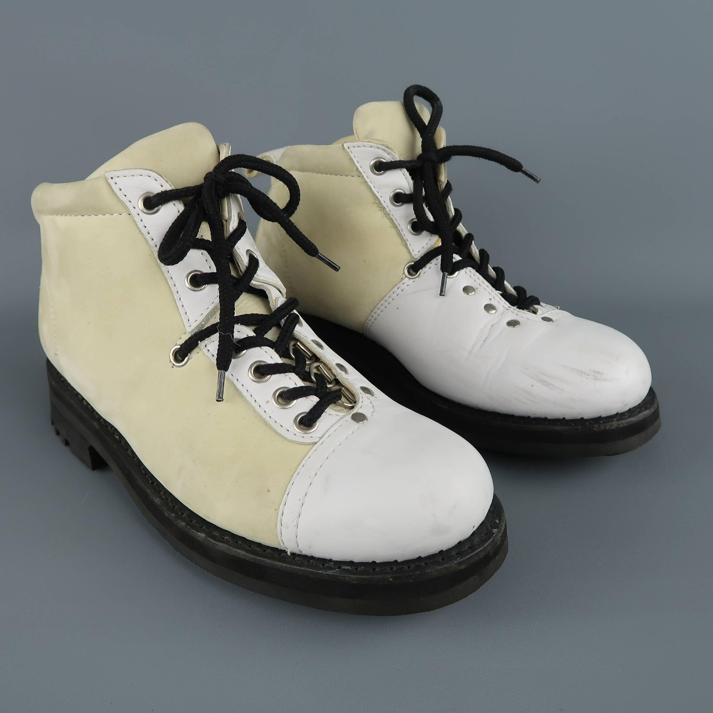 JEAN-BAPTISTE RAUTUREAU boots come in a cream nubuck leather with white smooth leather panels and features a lace up front with silver tone grommets and ski hooks, leather heel loop, and thick commando sole. Scuffs and wear throughout. As-Is. Made
