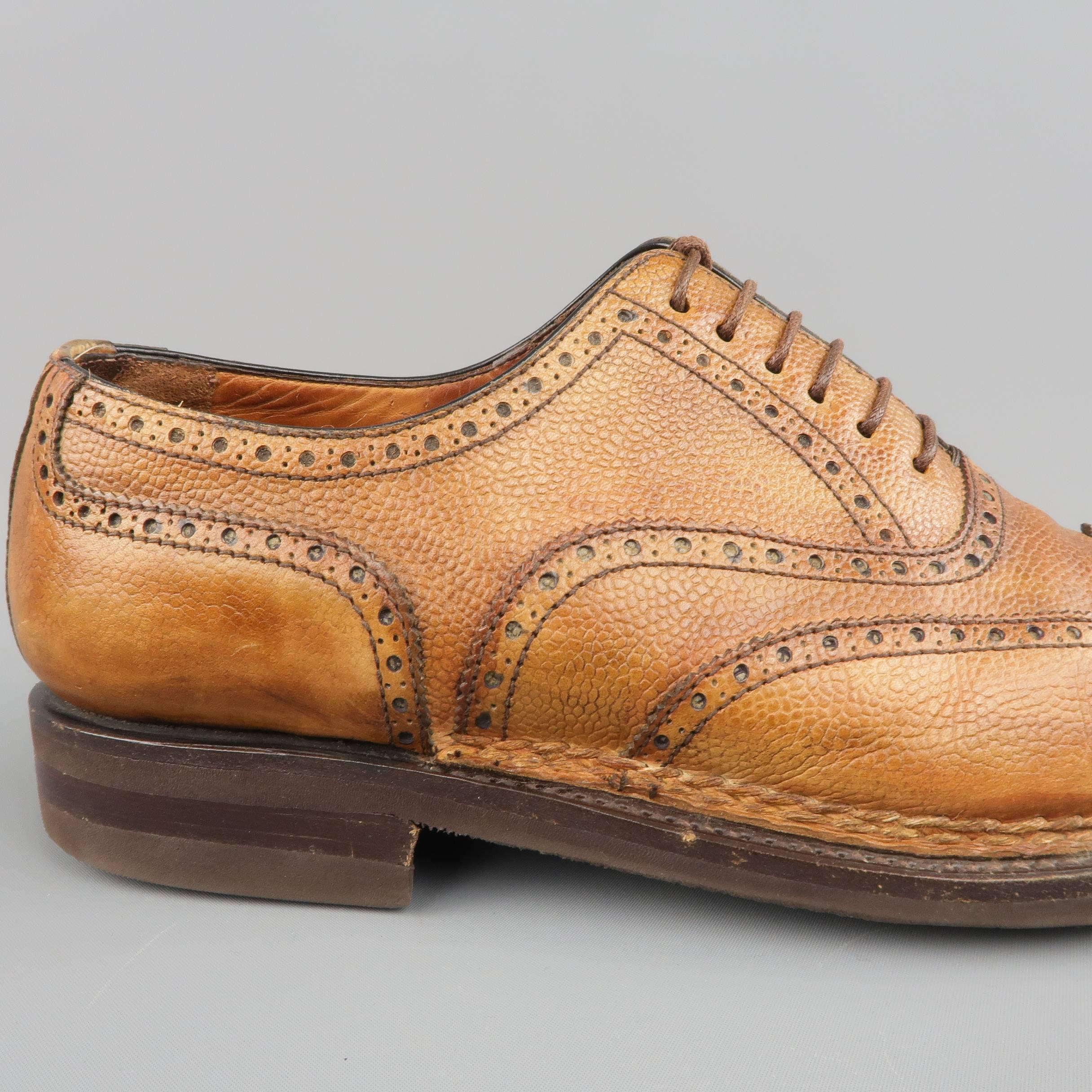 BONTONI dress shoes come in a dyed tan textured leather and feature a pointed wingtip toe, perforated brogue details throughout, leather mid, and rubber Vibram sole. Wear throughout leather. As-Is. Made in Italy.
 
Fair Pre-Owned Condition.
Marked: