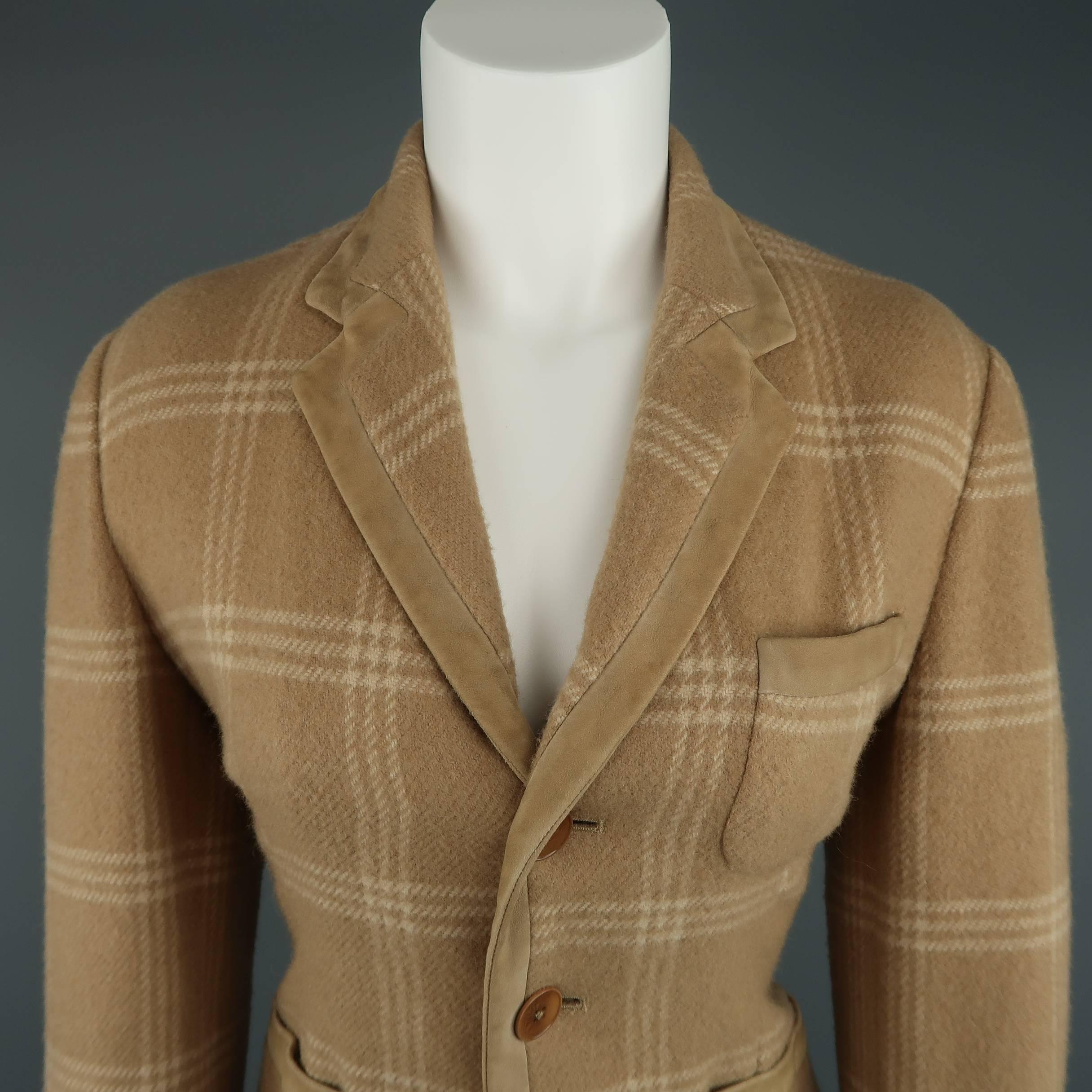RALPH LAUREN COLLECTION jacket comes in a camel and beige plaid wool and features a notch lapel, three button closure, and thick suede piping details throughout. Wear throughout suede. Made in USA.
 
Good Pre-Owned Condition.
Marked: US 8
